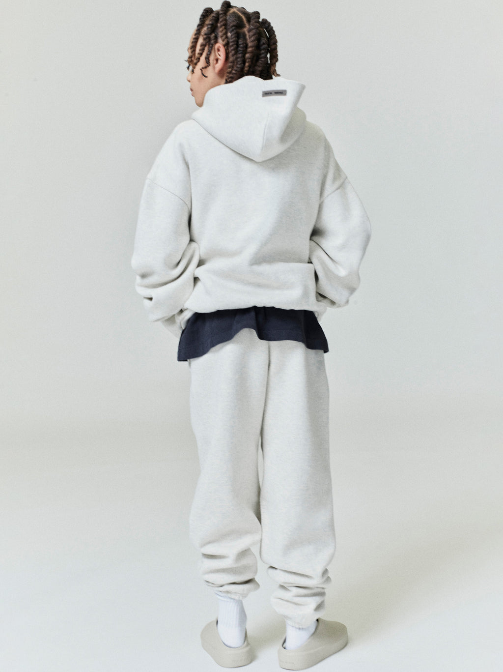 Rear view of oatmeal Kids Embossed Classic Hoodie showing relaxed fit and hood, gallery position 0, file 0000_HO25_K_L76_4071.jpg