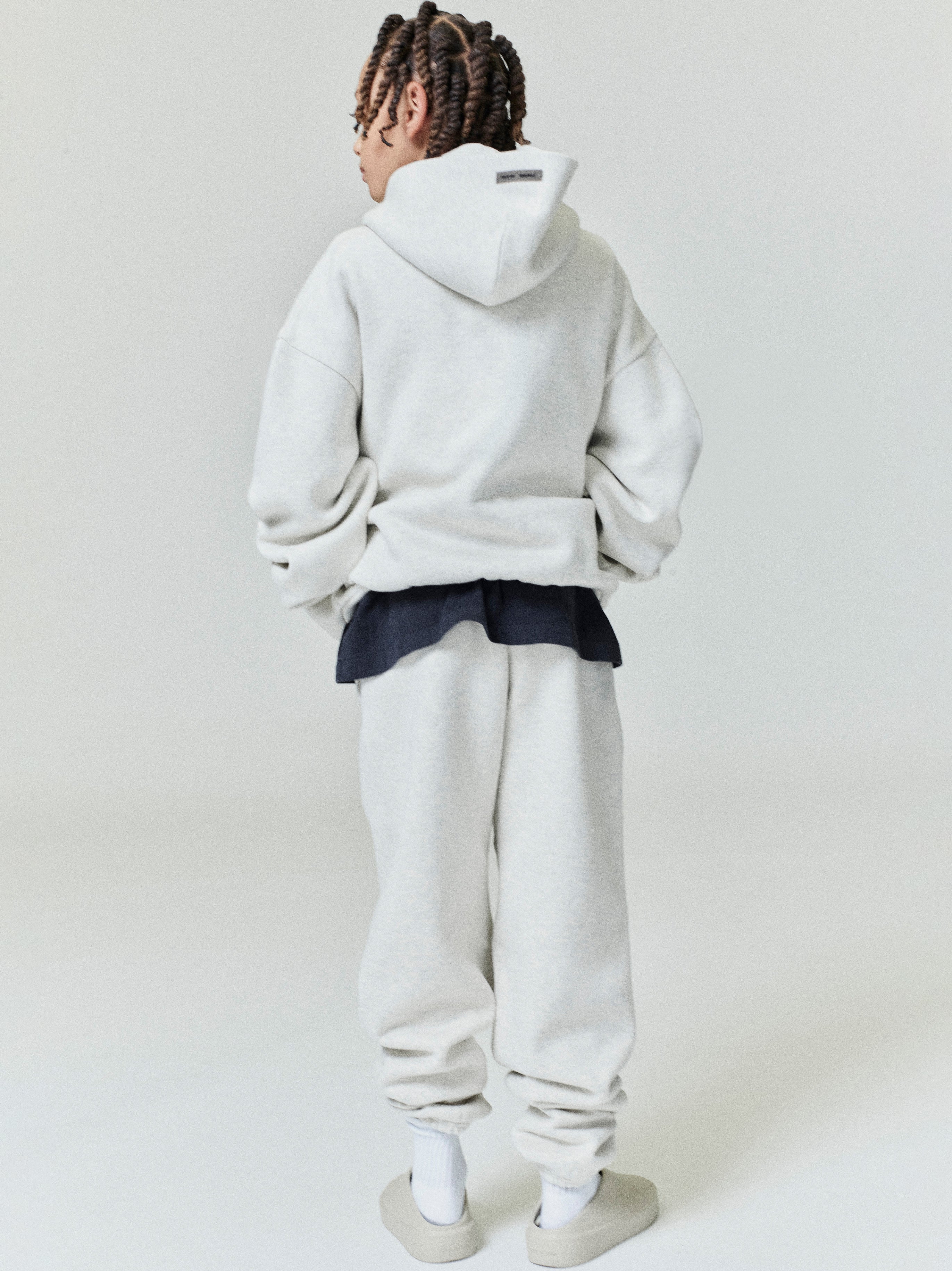 Rear view of child wearing light grey Kids Classic Sweatpant with relaxed fit and oversized matching hoodie, gallery position 0