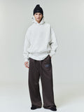 Model wearing dark brown Satin Fleece Lounge Sweatpant with relaxed wide leg and drawstring waist, gallery 0 file 0007_HO25_F_L28_P30_3394copy.jpg