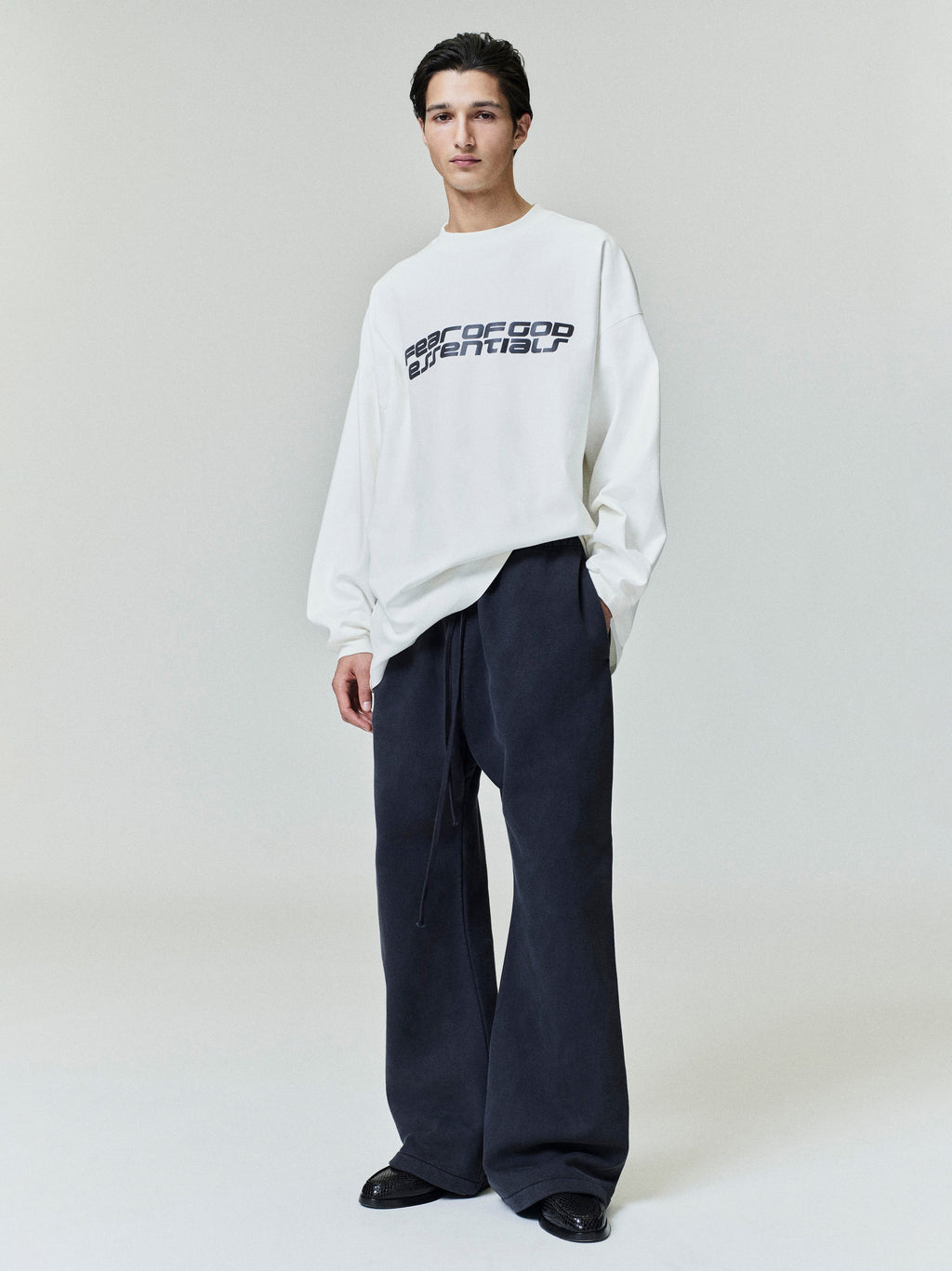 Model wearing navy Heavy Fleece Flare Sweatpant with wide legs and drawstring waistband, gallery image 0, file 0019_HO25_F_L80_4280.jpg