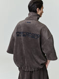 Rear view of model wearing suede fleece high neck jacket with wide 3/4 sleeves and printed back, file 0026_HO25_F_L15_1833_OnModelImage.jpg