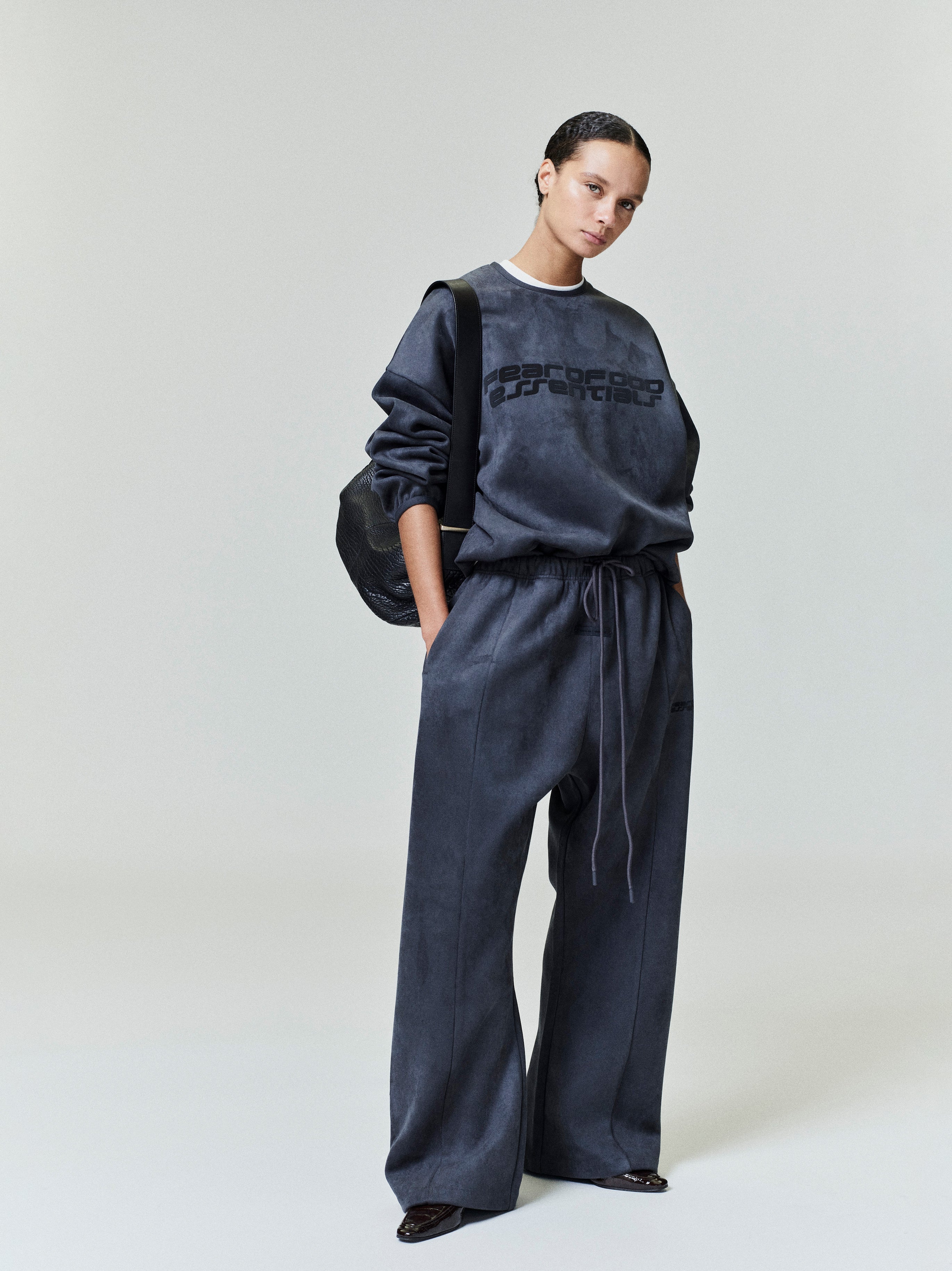Model wearing charcoal Suede Fleece Modern Crewneck Sweatshirt with matching wide-leg pants in file 0041_HO25_FW_L37_0422.jpg