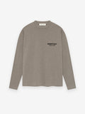 taupe medium-weight cotton jersey long sleeve tee with rib-knit crewneck and small black Essentials Fear of God logo on chest