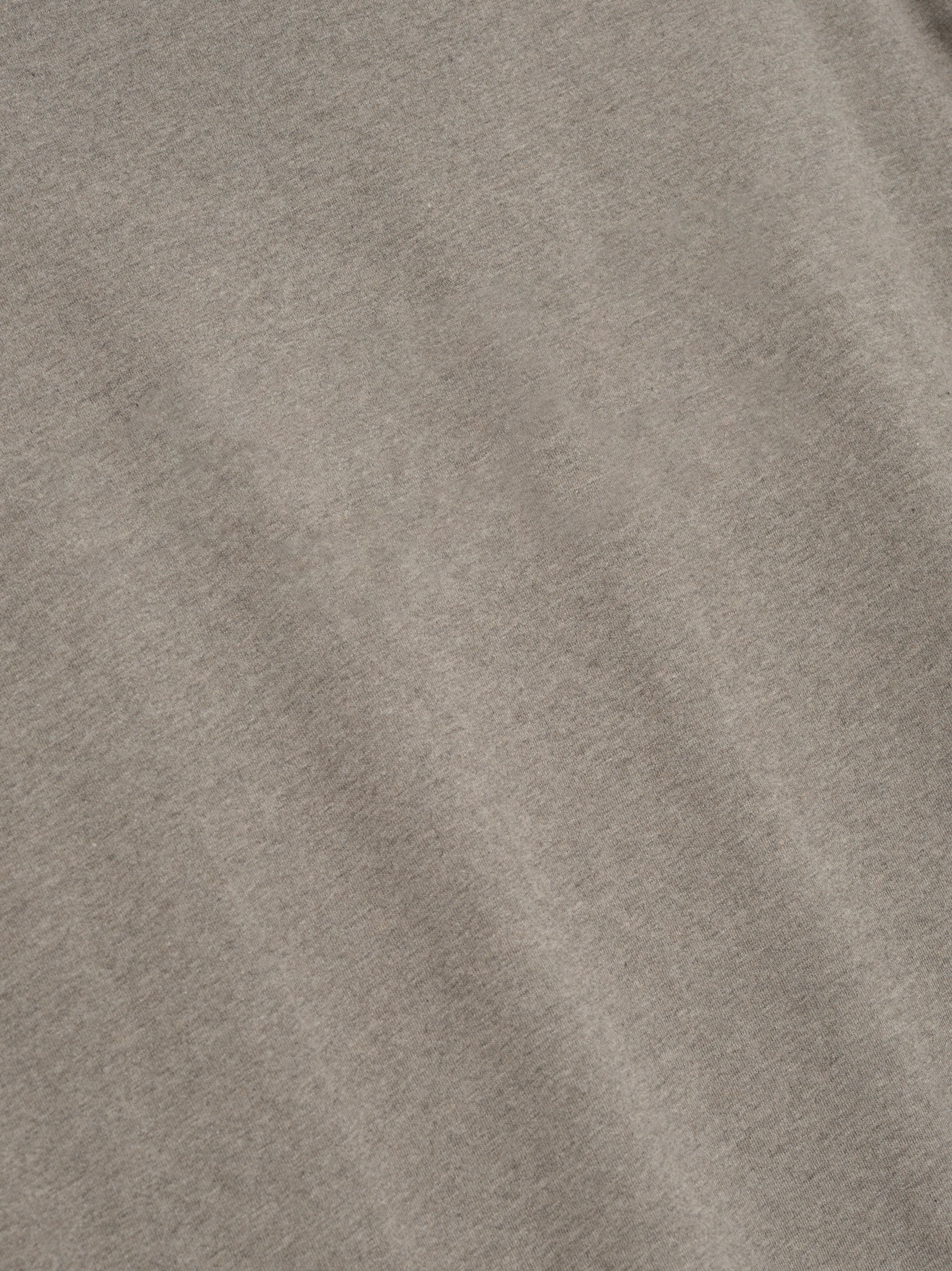 close-up of taupe medium-weight cotton jersey fabric with soft texture from Essentials SS26 Classic Long Sleeve Tee