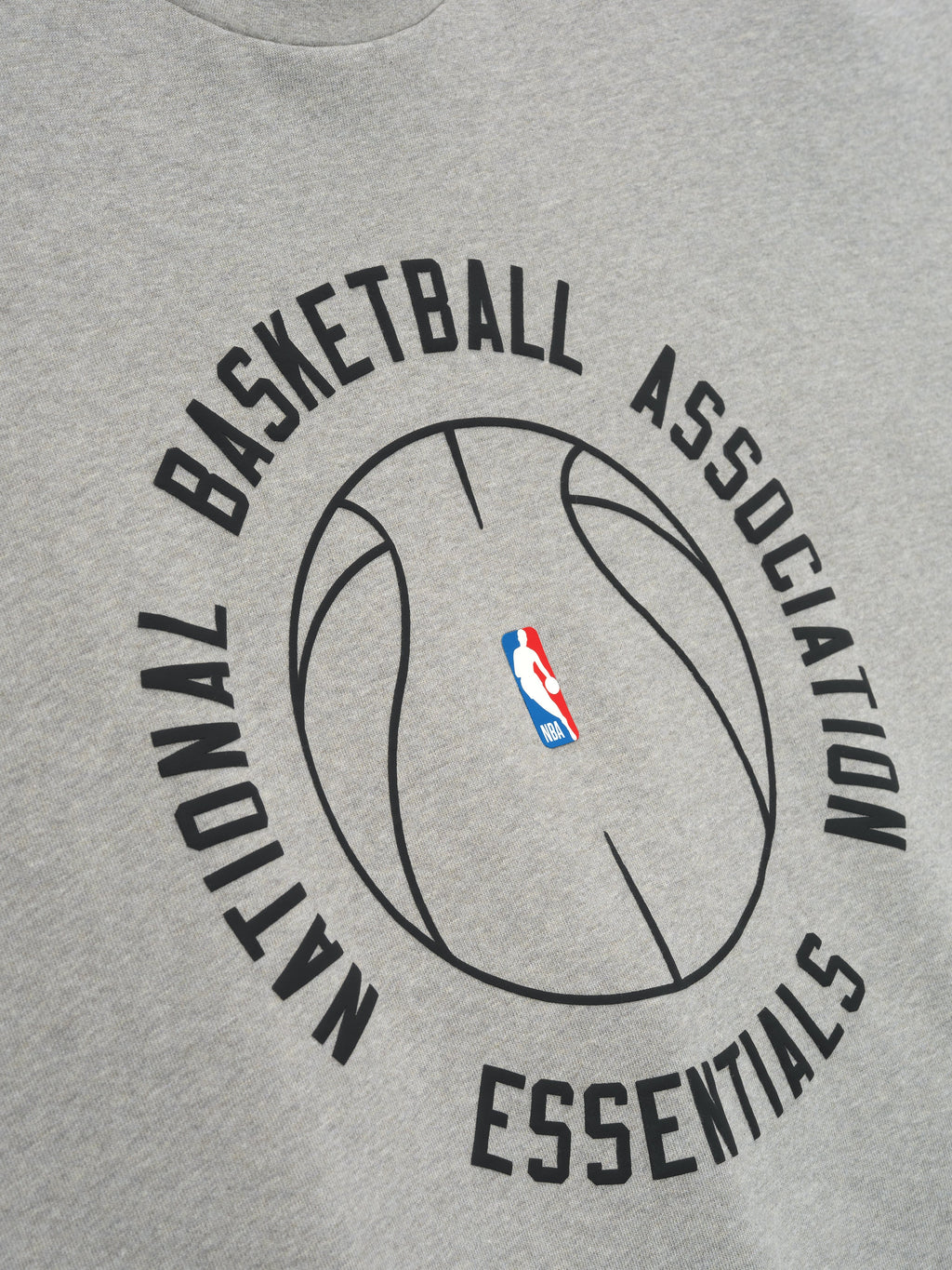 light grey heavyweight cotton jersey tee with large black NBA basketball outline and Essentials text on front