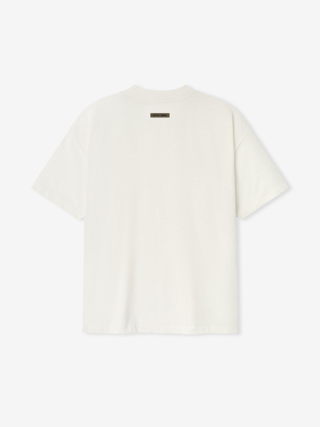 Back view of ivory Embroidered Essential Tee featuring small rectangular label near neckline, flat lay on white background