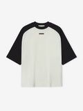 Ivory Baseball Tee with contrasting black raglan sleeves and a small centered label on the chest, front view.