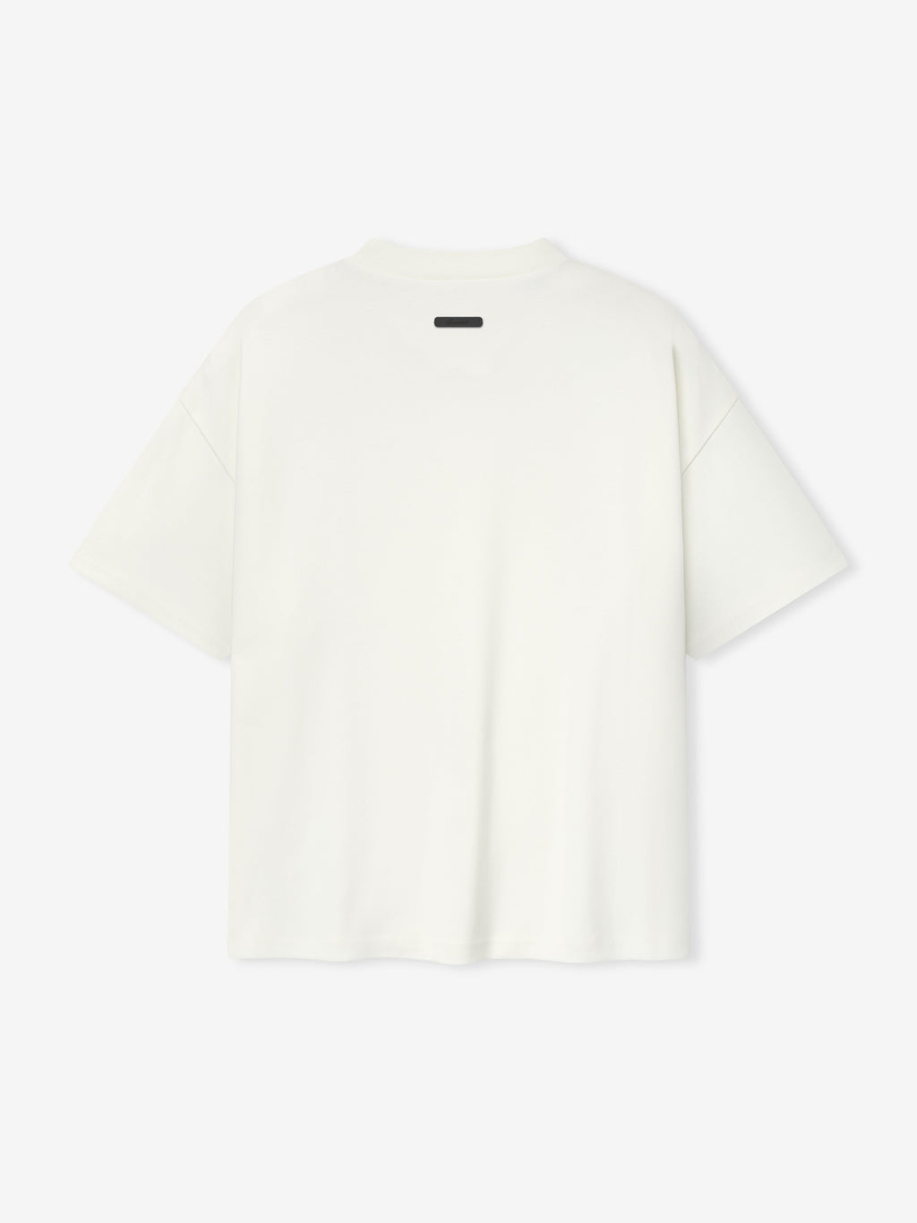 back view of white medium-weight cotton poly pique tee with oversized 90s fit and dropped shoulders