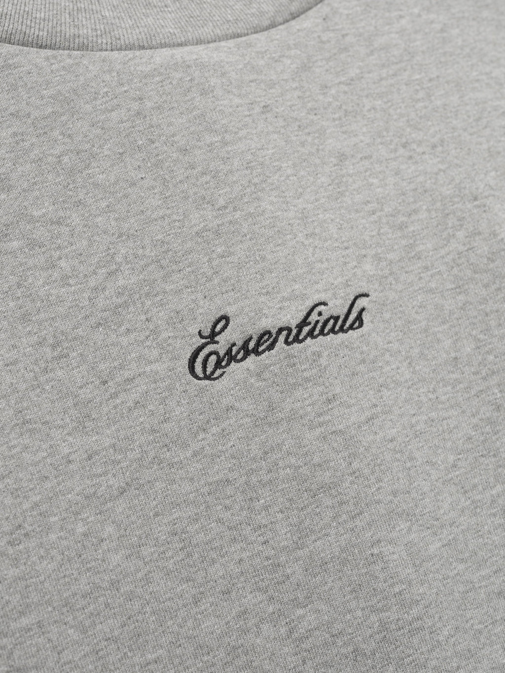 Gray t-shirt with 'essentials' logo.