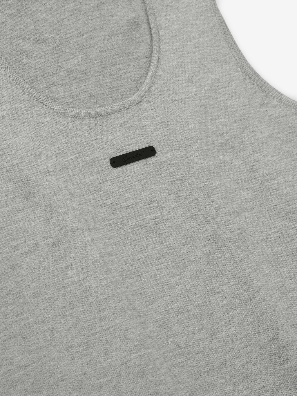 close-up of women's grey rib-knit tank top with scoop neckline and small black logo detail on chest