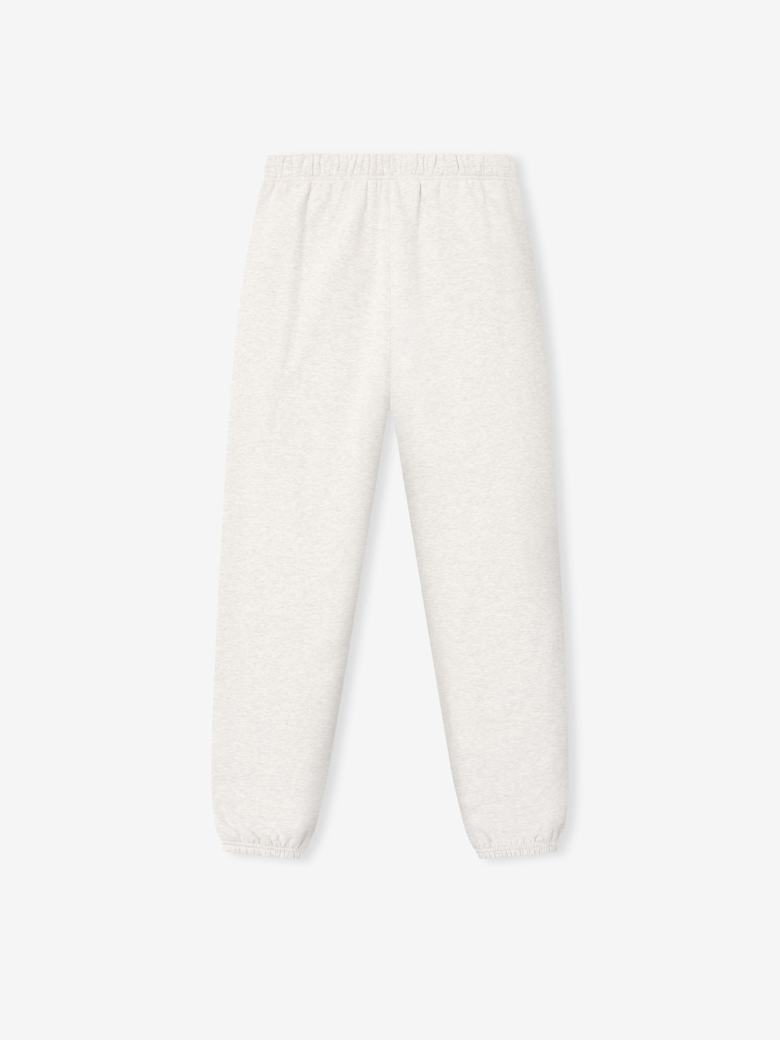 off-white fleece sweatpant with elastic waistband and cuffs featuring a subtle puff-printed signature logo on leg