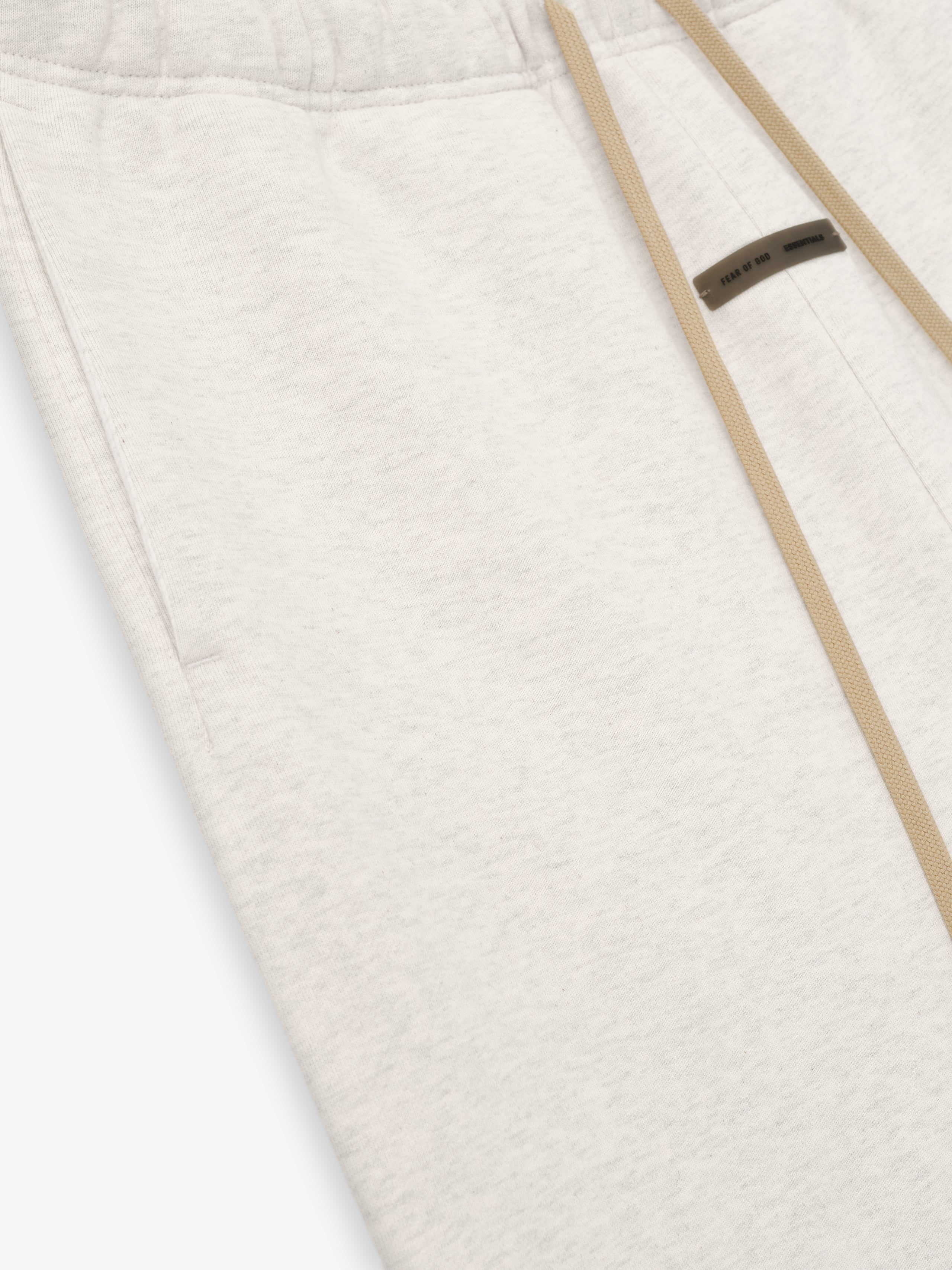 Close-up of oatmeal heather Classic Sweatpant with beige drawstring and subtle texture on soft fabric