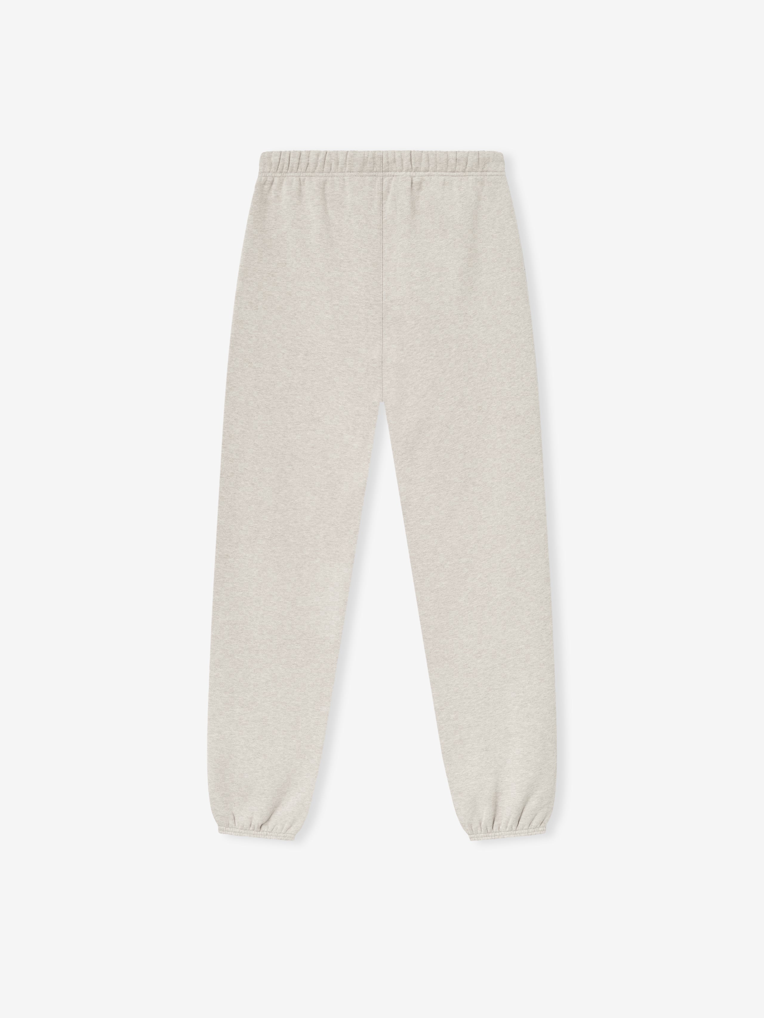 top view of beige vintage fleece sweatpant with elastic waistband and cuffed ankles in slim tapered fit