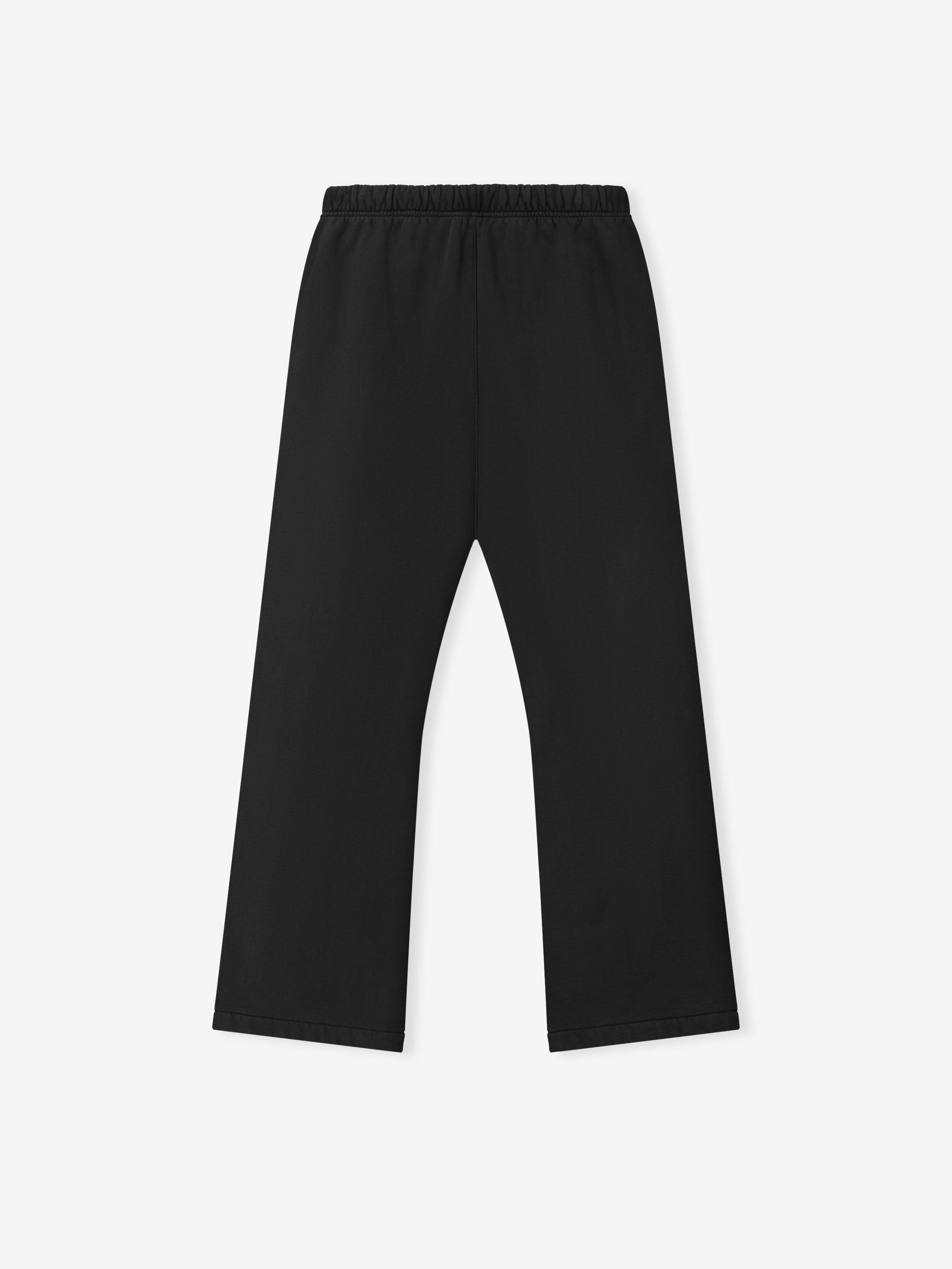 black heavyweight fleece sweatpants in relaxed fit with elastic waistband and classic flare leg silhouette