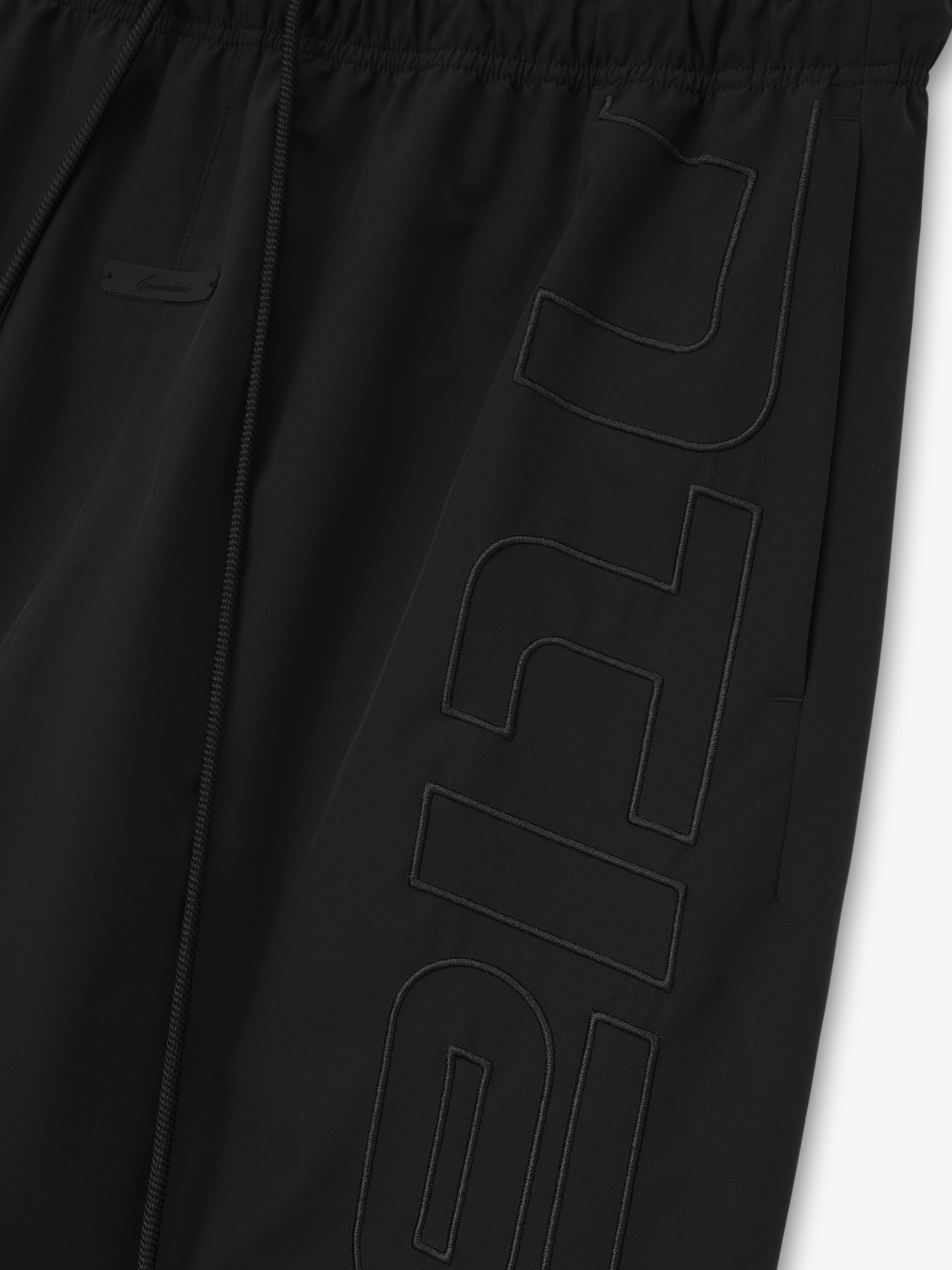 Black pants with a logo on a white background