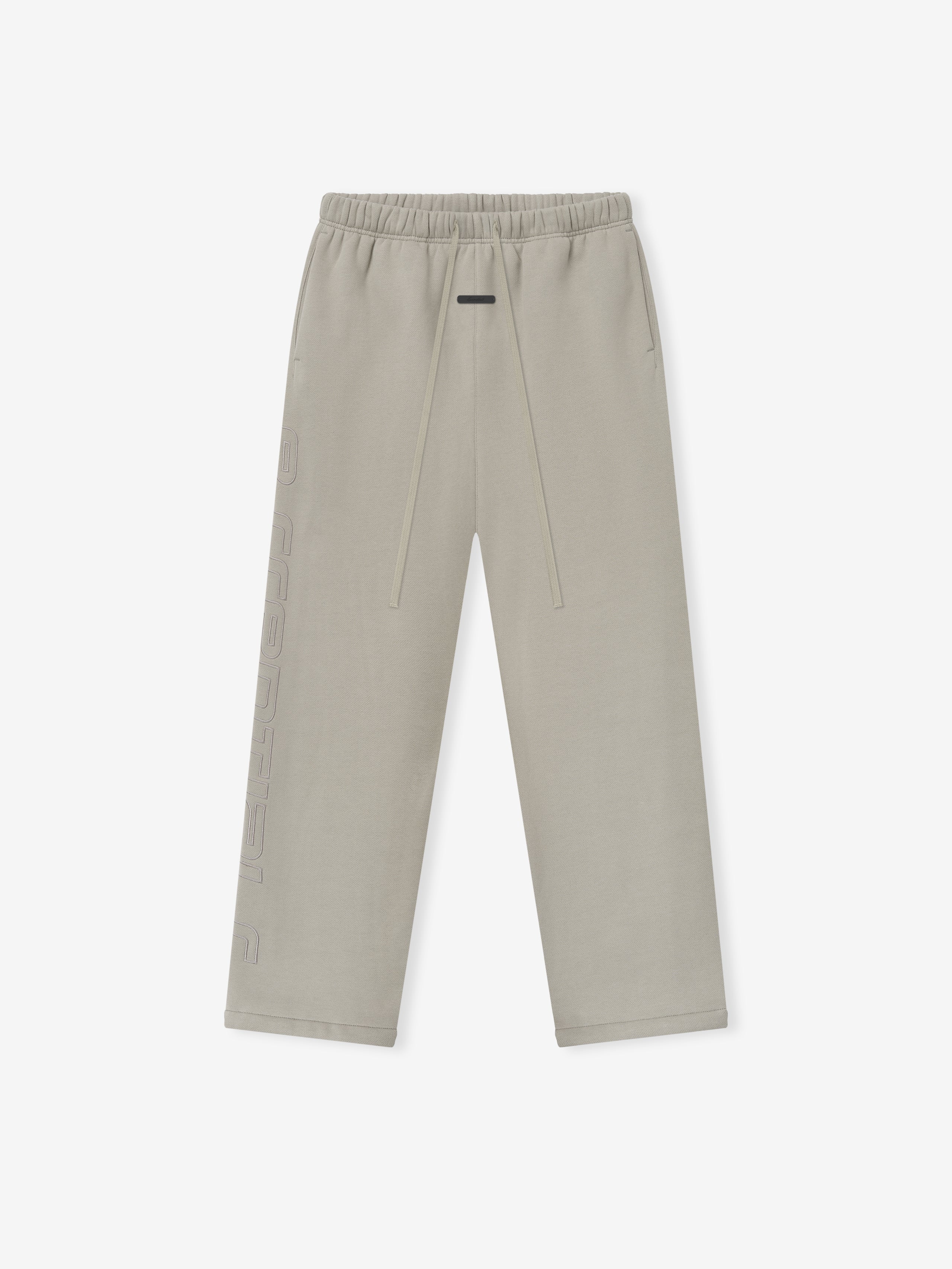 light beige relaxed fit sweatpants with elastic waistband, drawstring, and embossed logo detail down the leg