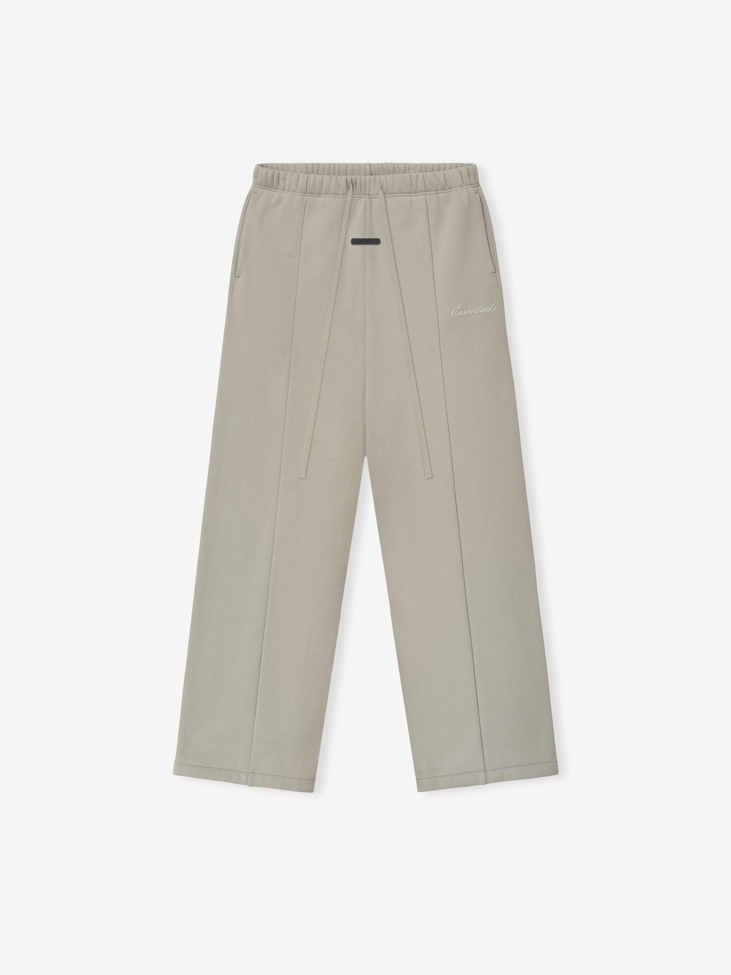 Grey pants on a white background with a white emboridered "Essentials" signature logo.