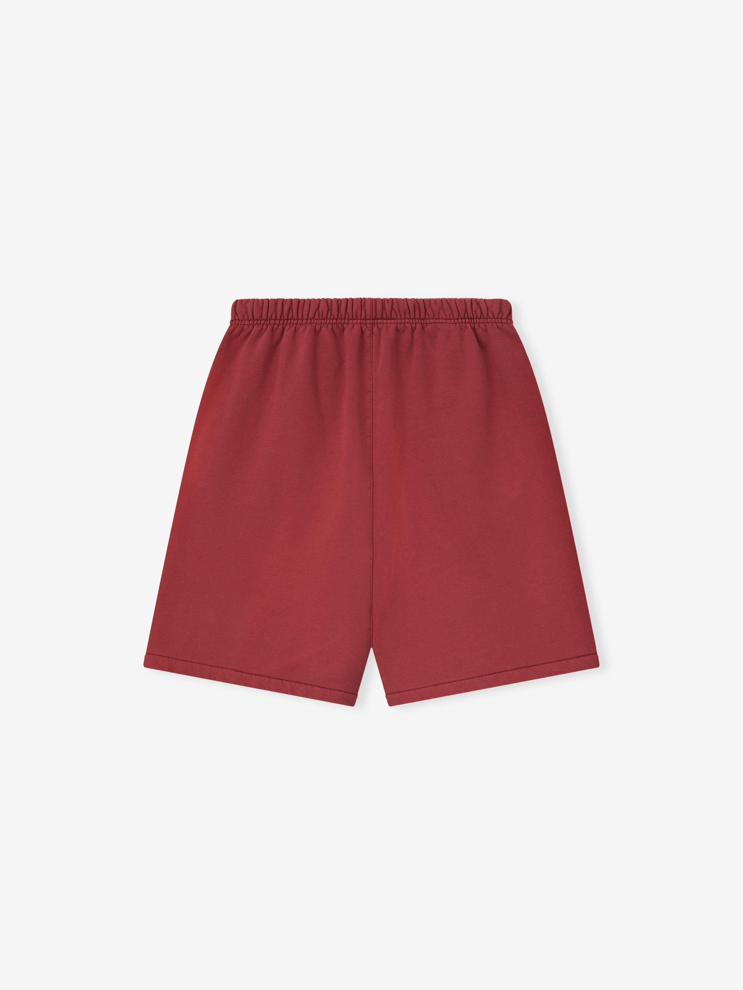 Back view of crimson relaxed sweatshorts with elastic waistband and clean hem on white background