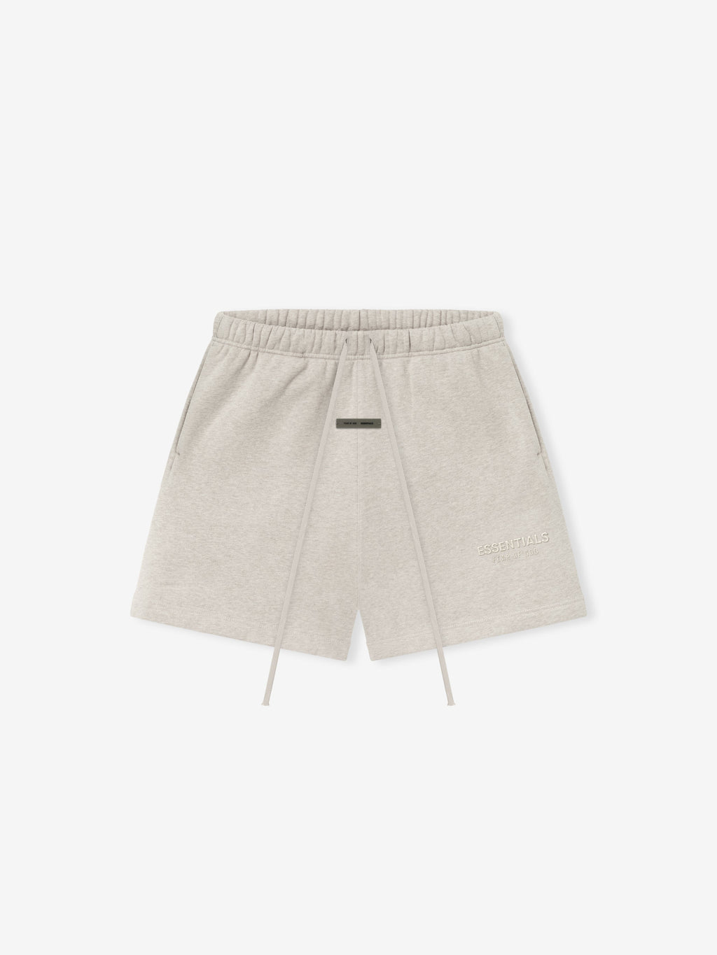 light beige core fleece sweatshort with elastic waist, long drawstrings, side pockets, and subtle Essentials logo on thigh