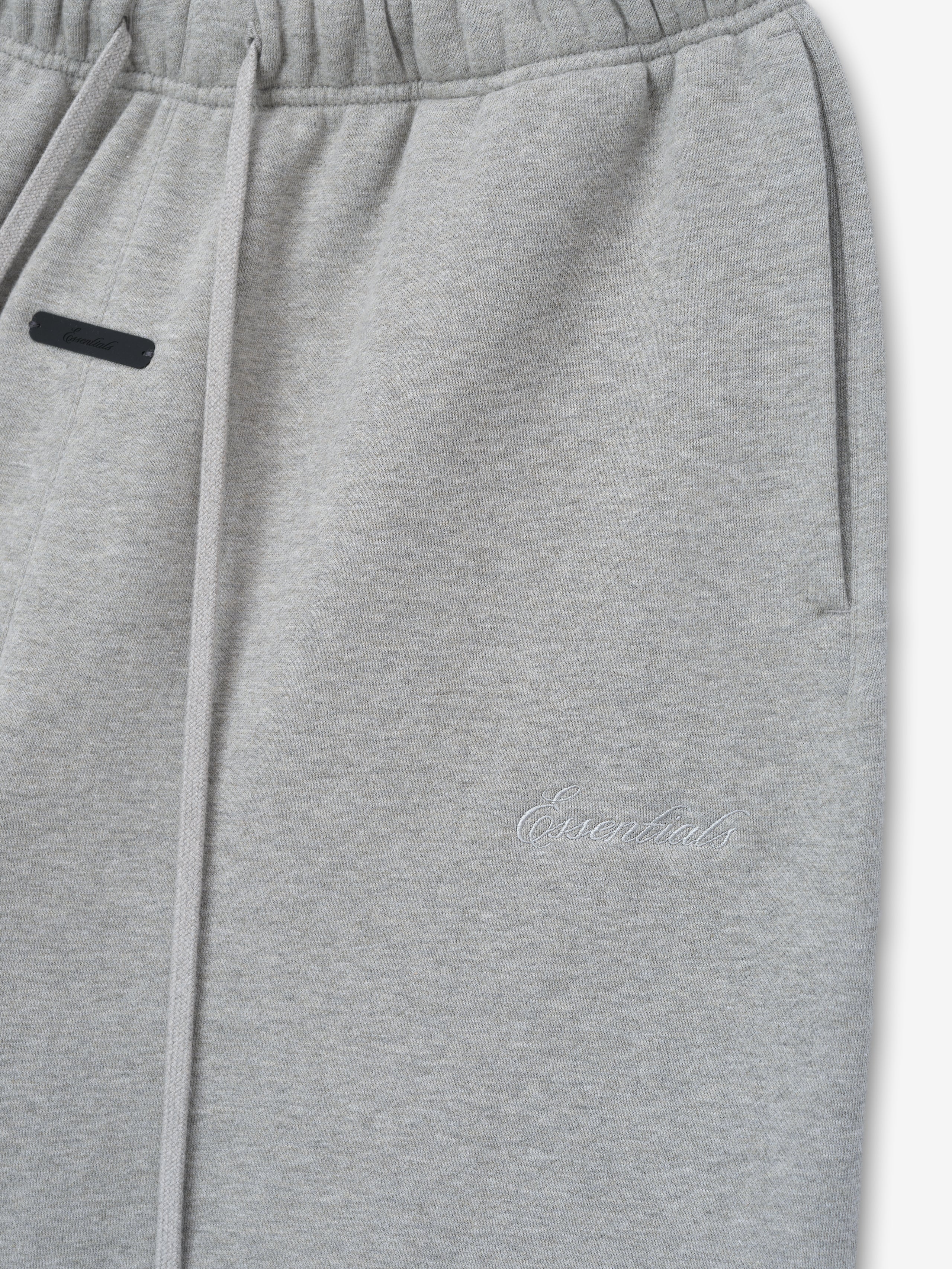 Gray sweatpants with a brand logo on a light gray background