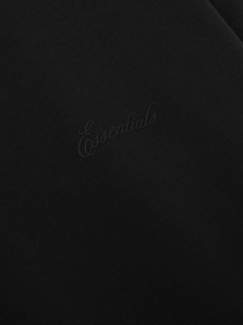 Black sweater with 'Essentials' signature logo