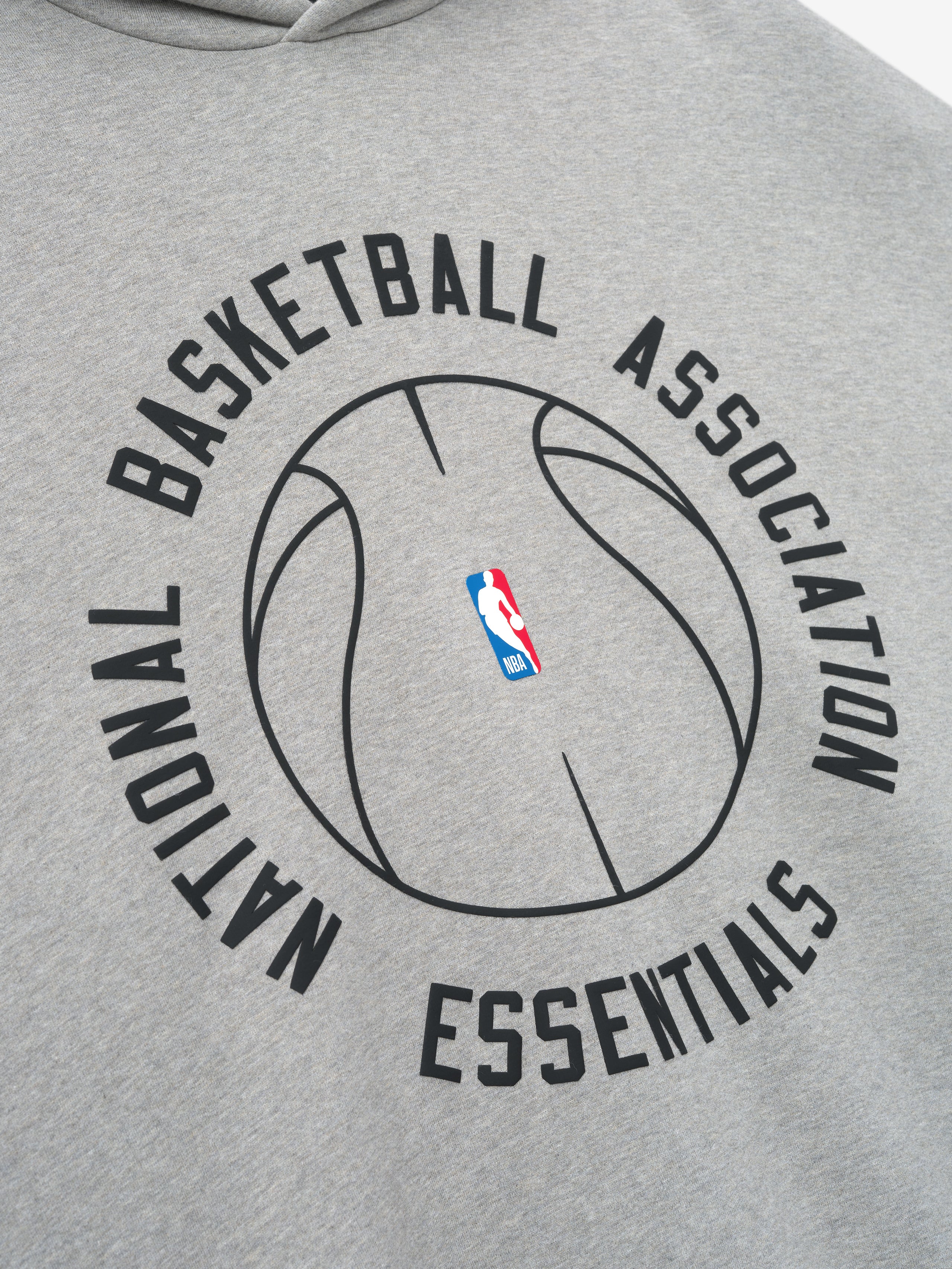 light grey heavyweight cotton fleece hoodie with circular NBA Essentials text and outlined basketball graphic on front