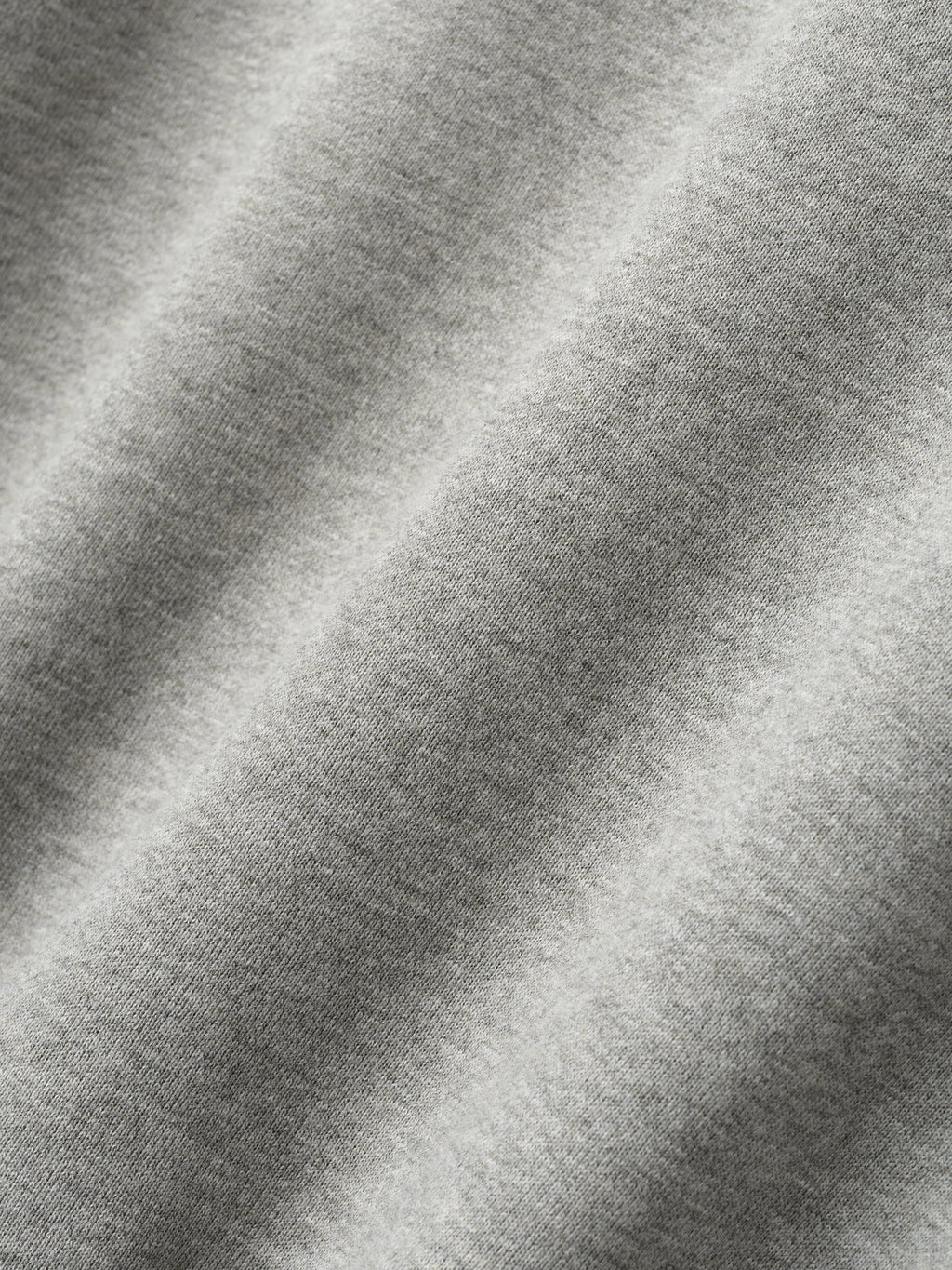 Close-up of concrete heather fabric texture detail from London 90s Hoodie, gallery position 0.