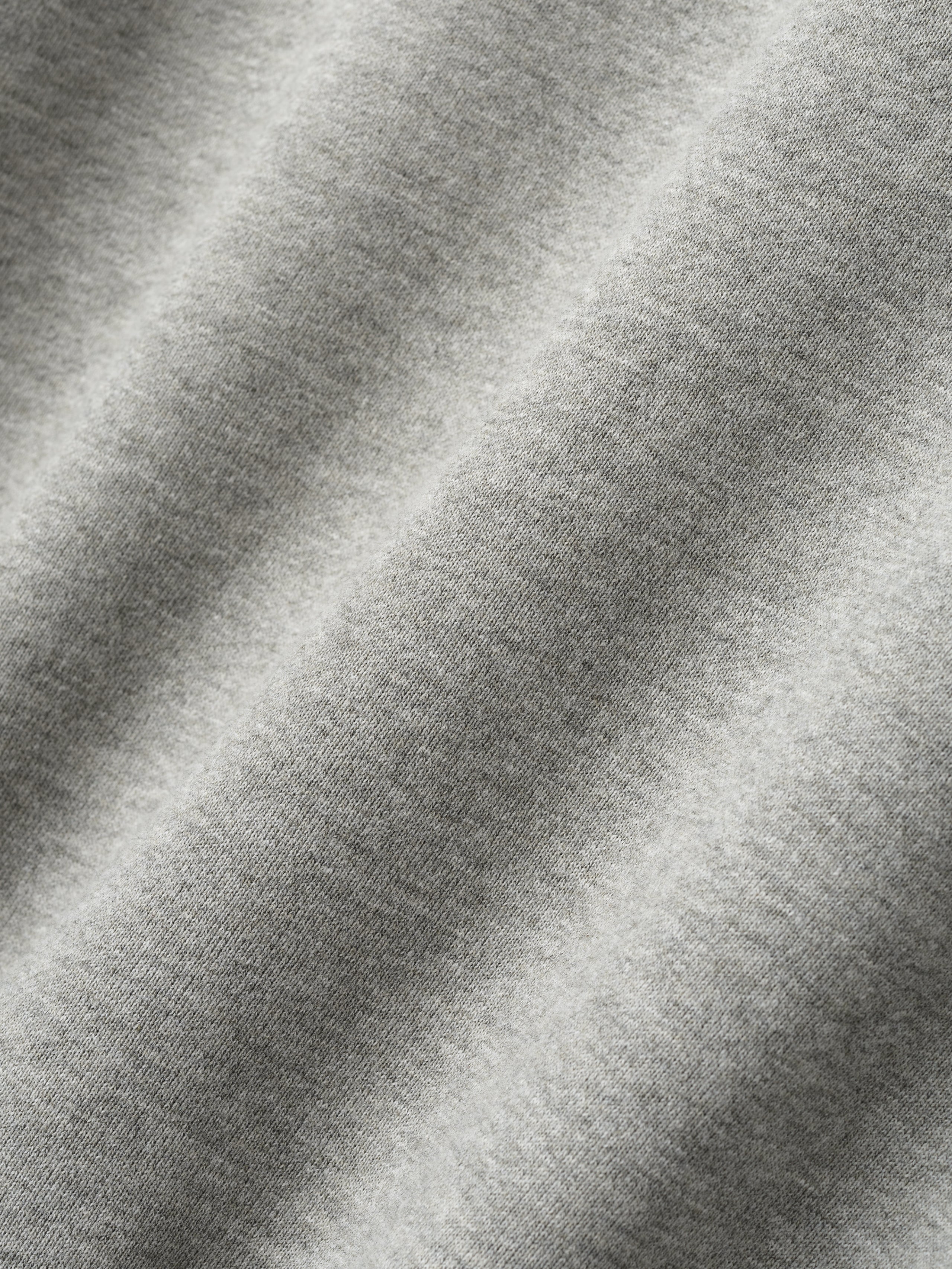 Close-up of concrete heather fabric texture detail from London 90s Hoodie, gallery position 0.