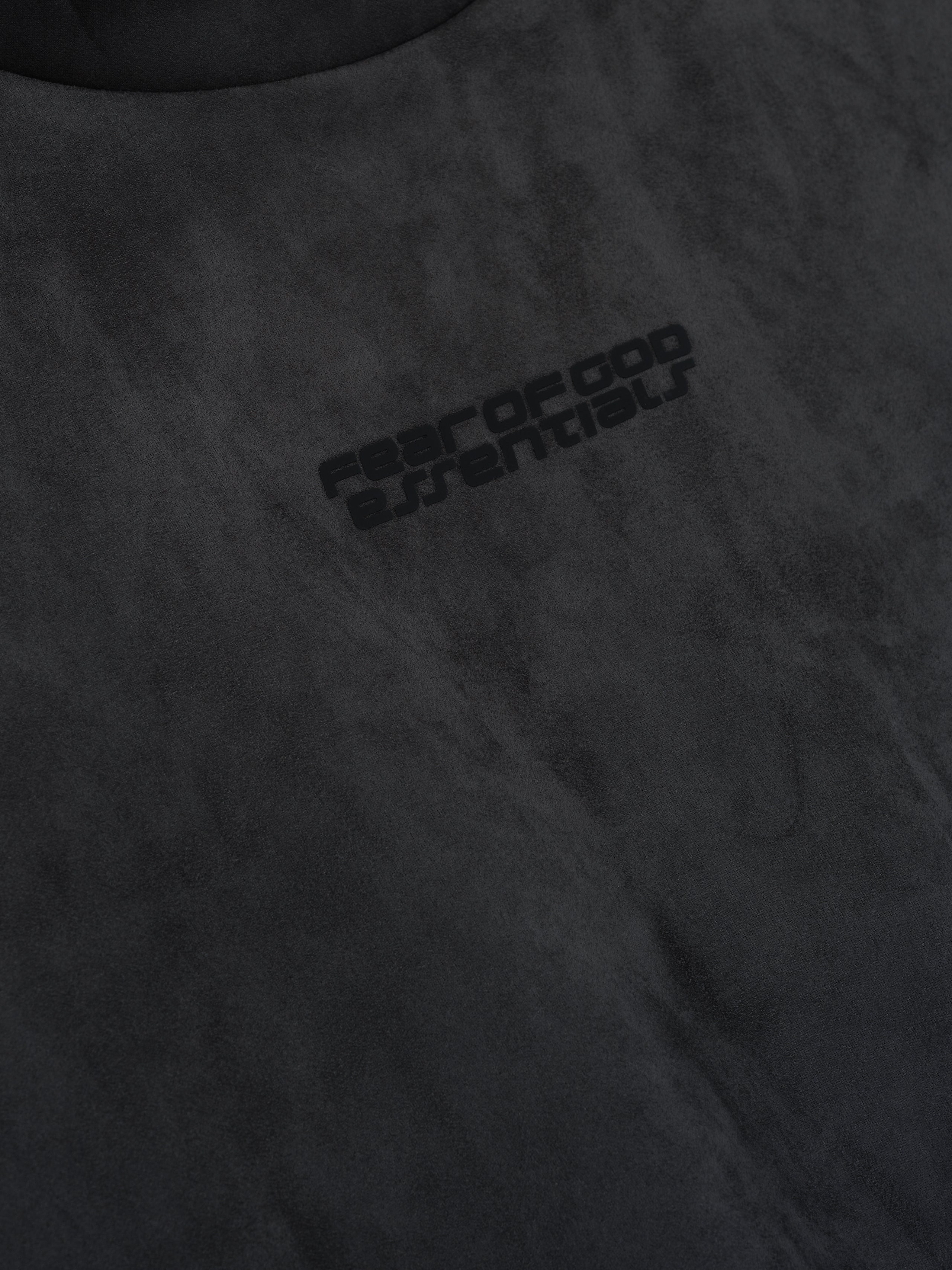 Close-up of iron grey suede fleece modern hoodie fabric with subtle Fear of God Essentials logo print