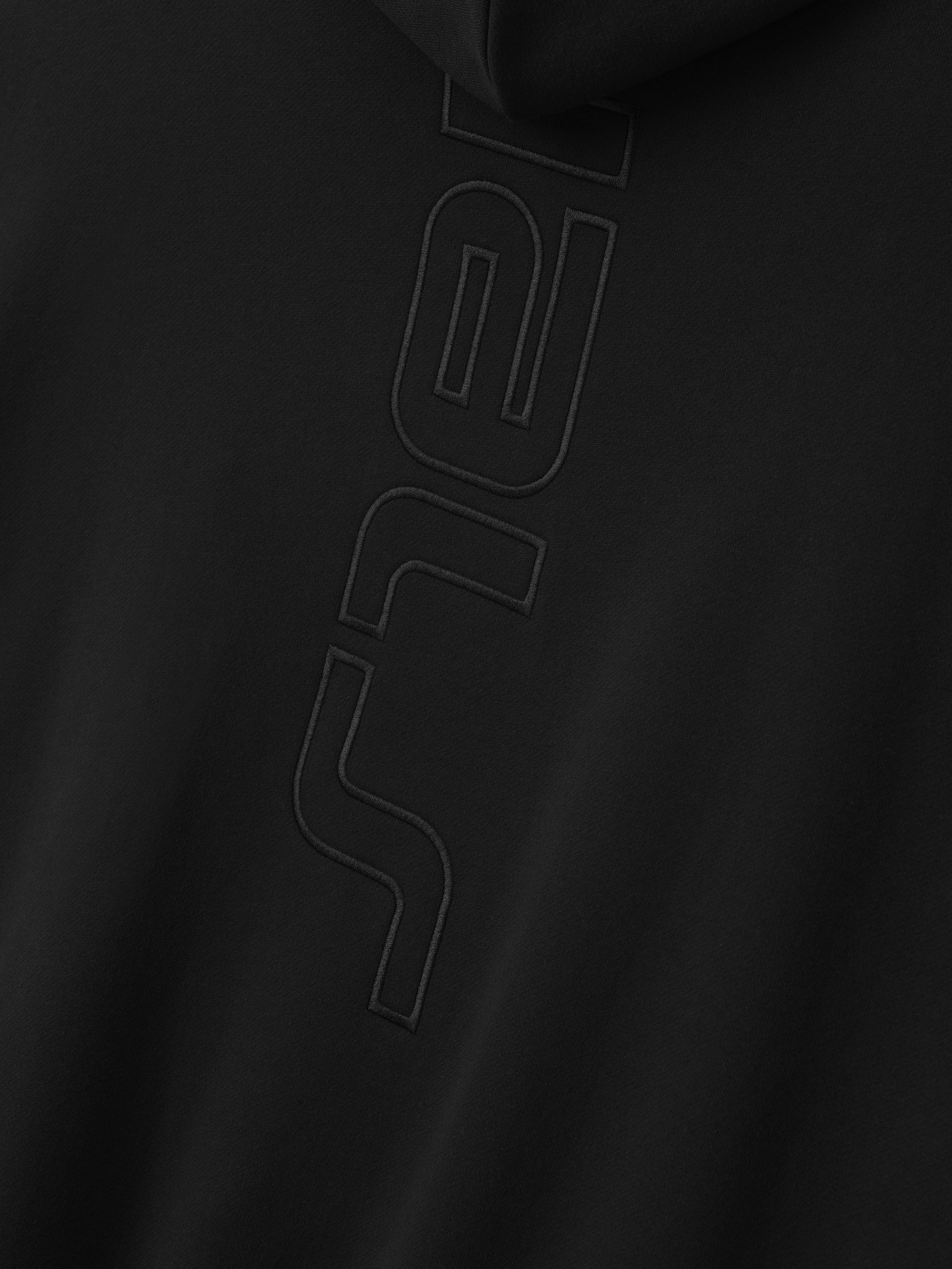 black heavyweight fleece hoodie with embossed vertical Active Trace logo on front center panel