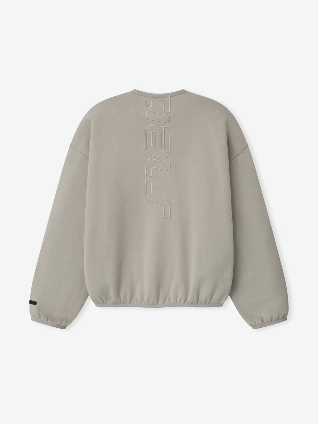 Back view of light taupe sweatshirt with vertical embossed lettering down center and elasticated cuffs and hem