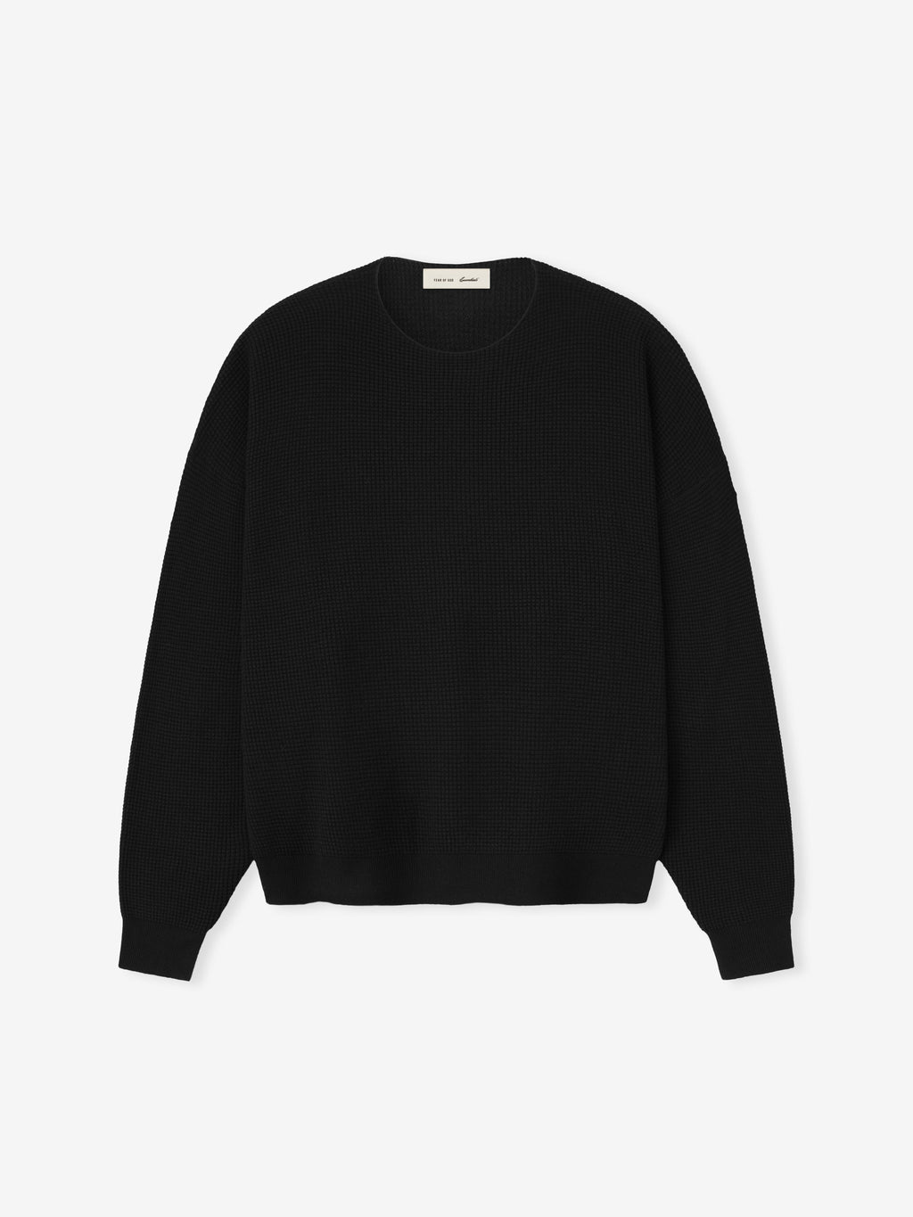 Black sweater on a light gray background