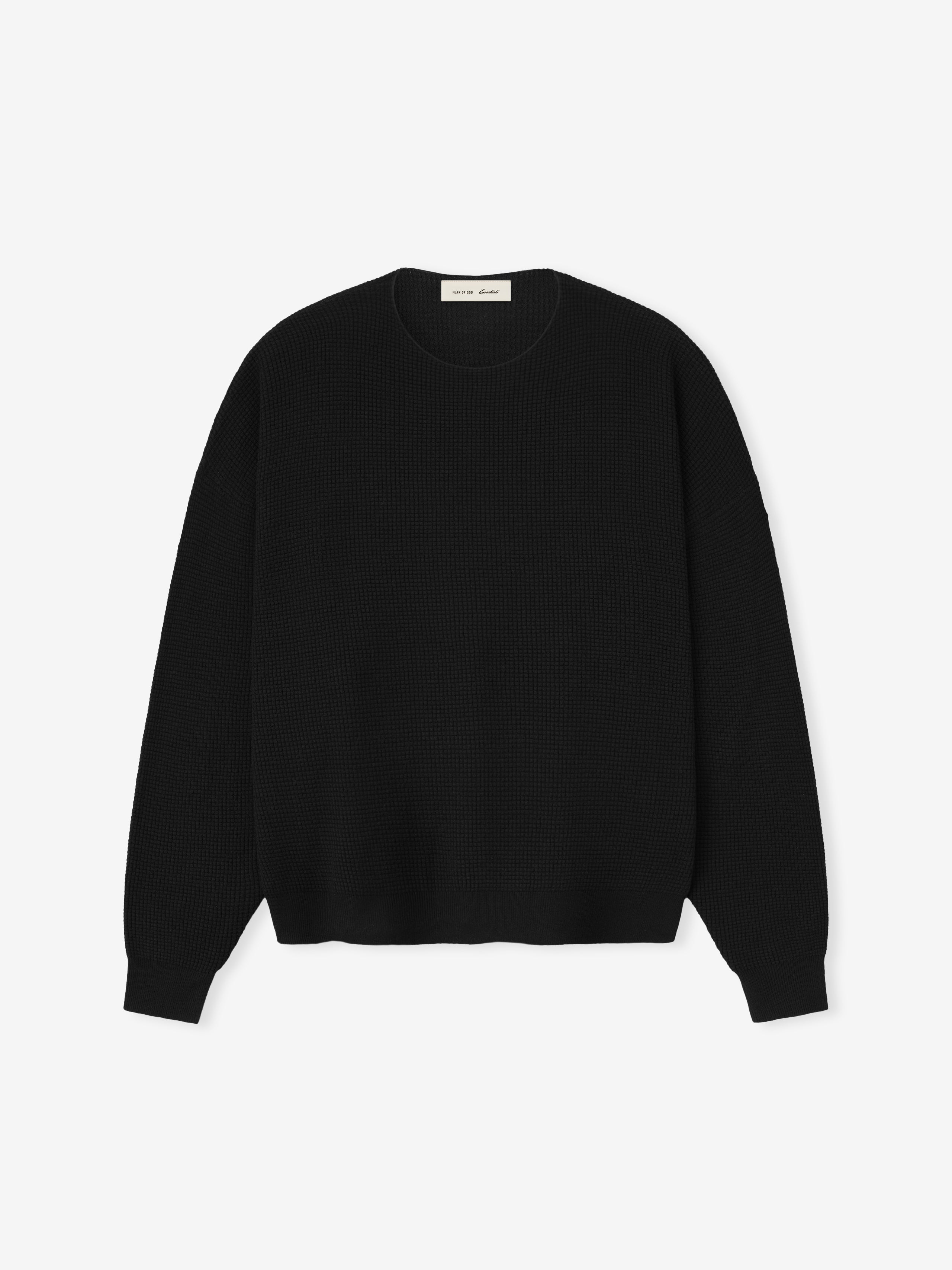 Black sweater on a light gray background