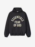 front view of black heavyweight hooded sweatshirt with cream Essentials Fear of God printed logo and ribbed cuffs and hem
