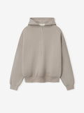 front view of beige heavyweight half-zip hoodie with dropped shoulders and double-layer hood and ribbed hem and cuffs