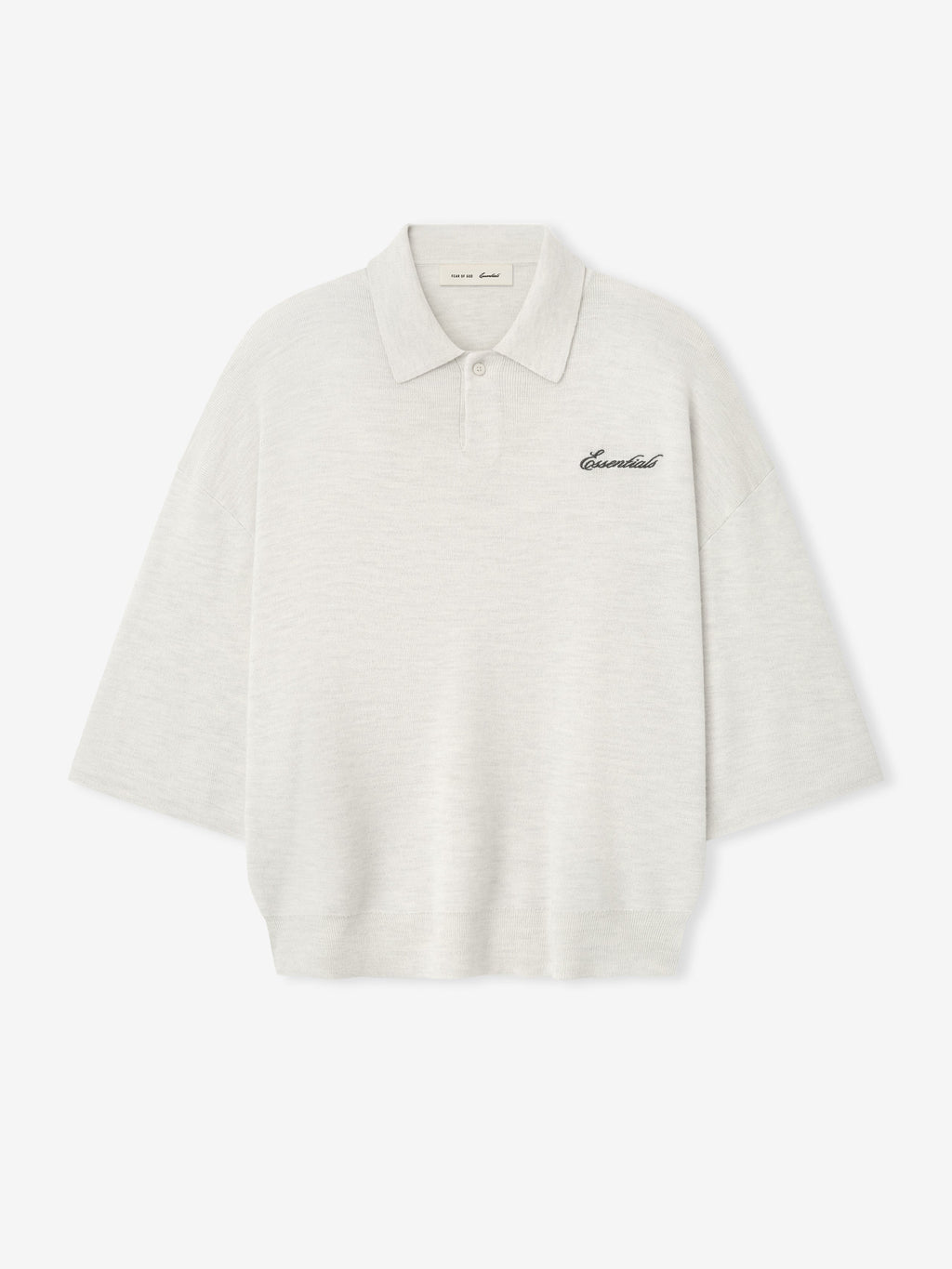 off-white heavy merino knit polo with 3/4 sleeves, relaxed fit, classic collar, and black Essentials script embroidery on chest