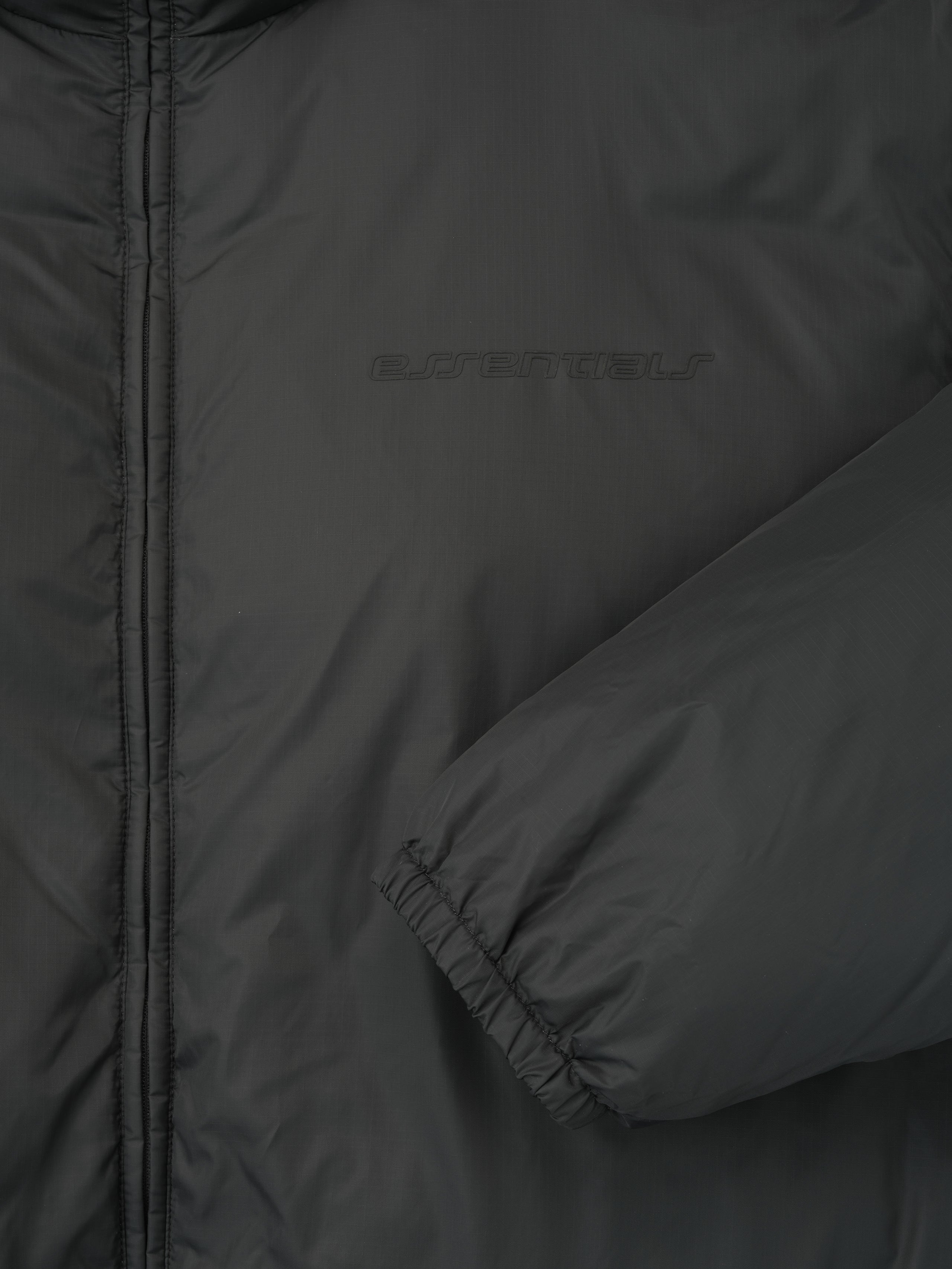 Close-up of iron grey ripstop nylon puffer jacket sleeve and chest area highlighting subtle texture and branding, file 202HO258151F_PUFFER_JACKET-IRON_GREY_3.jpg
