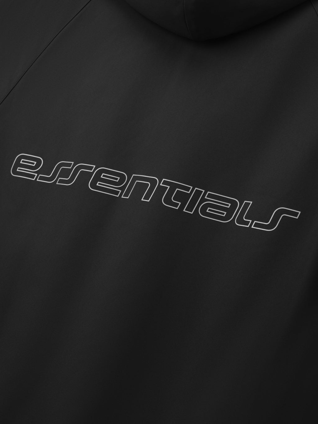 Close-up of vintage black Tech Nylon Hooded Parka showing curved essentials logo on the back panel gallery 0