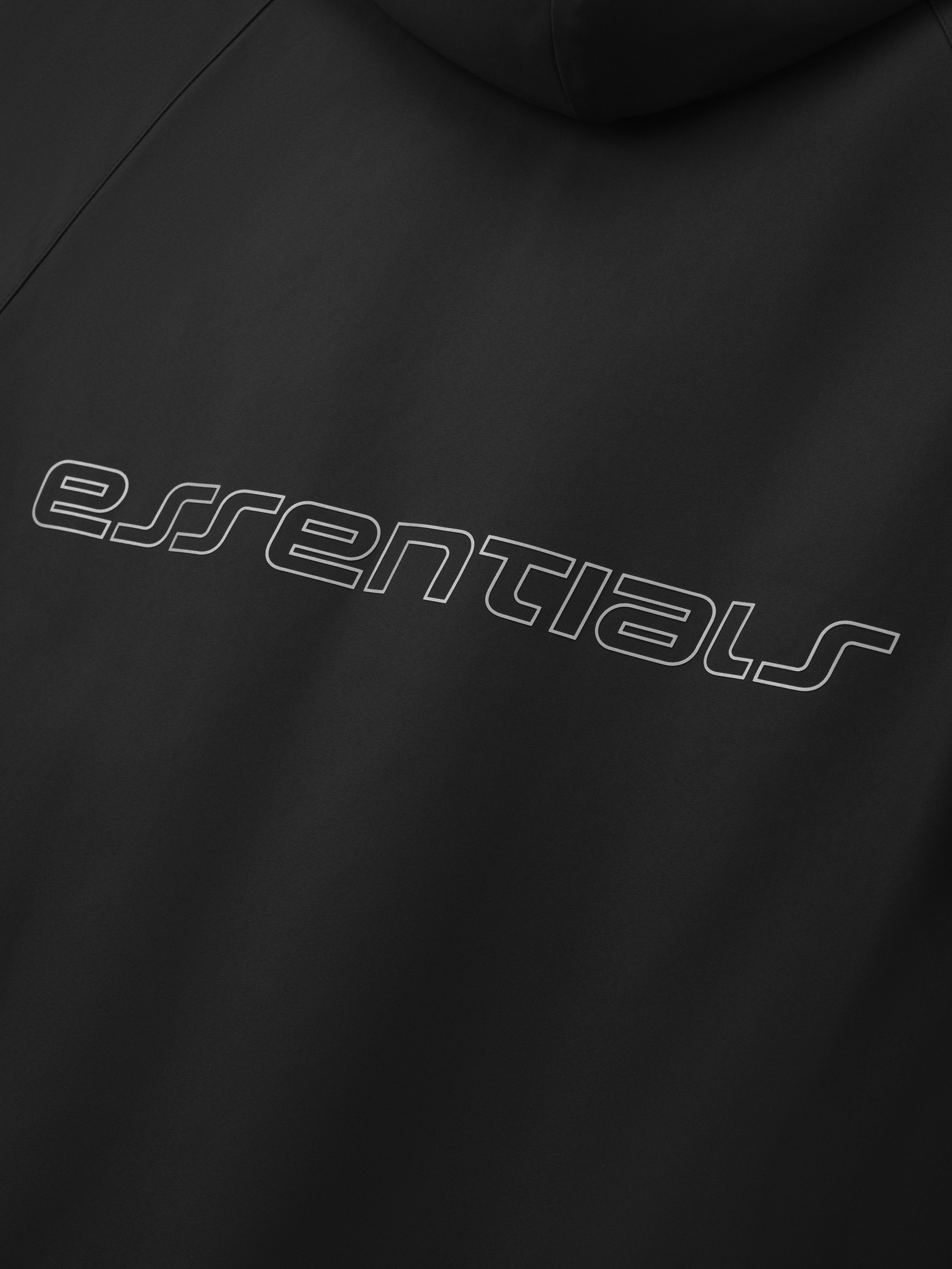 Close-up of vintage black Tech Nylon Hooded Parka showing curved essentials logo on the back panel gallery 0