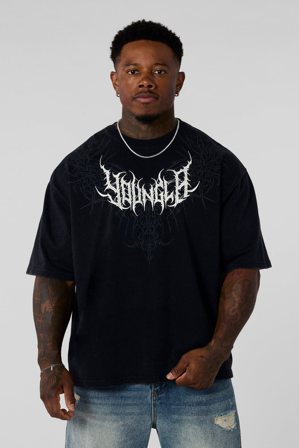 4149 - Gothic Tees- Oversized tee with bold gothic-inspired graphics on the back, structured yet comfortable, offering a sharp, wearable edge and statement-making style in Black Wash 