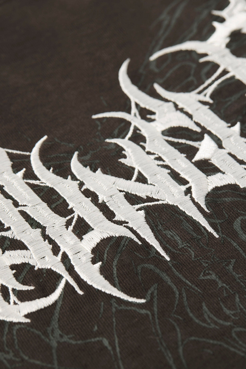 4149 - Gothic Tees- Oversized tee with bold gothic-inspired graphics on the back, structured yet comfortable, offering a sharp, wearable edge and statement-making style.