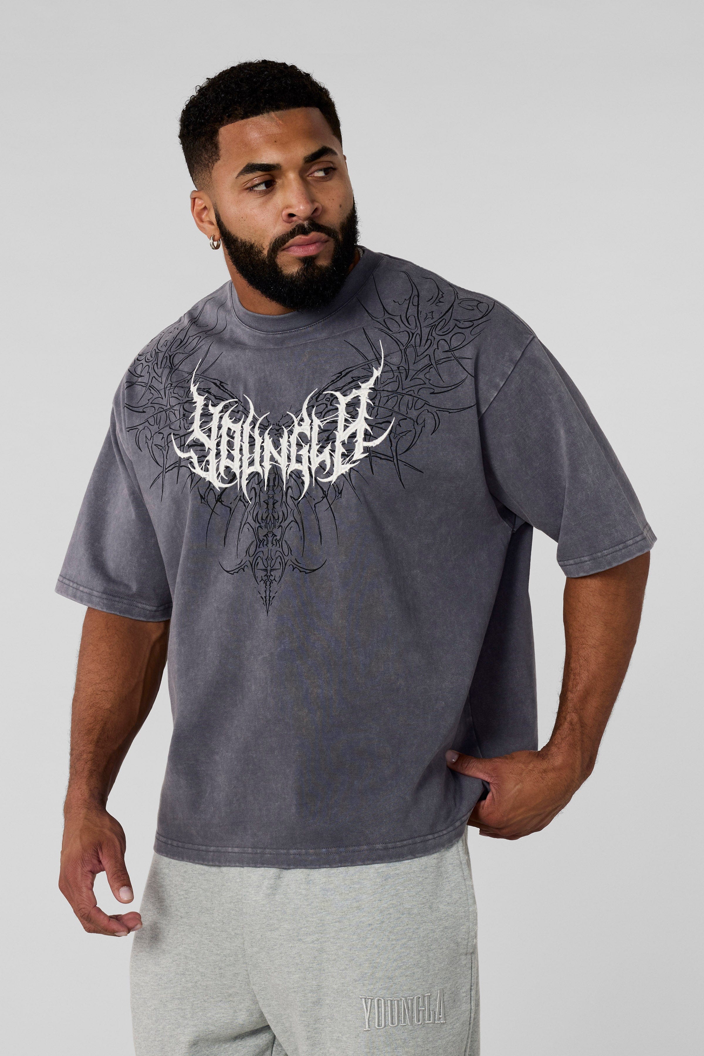 4149 - Gothic Tees- Oversized tee with bold gothic-inspired graphics on the back, structured yet comfortable, offering a sharp, wearable edge and statement-making style in Grey Wash 