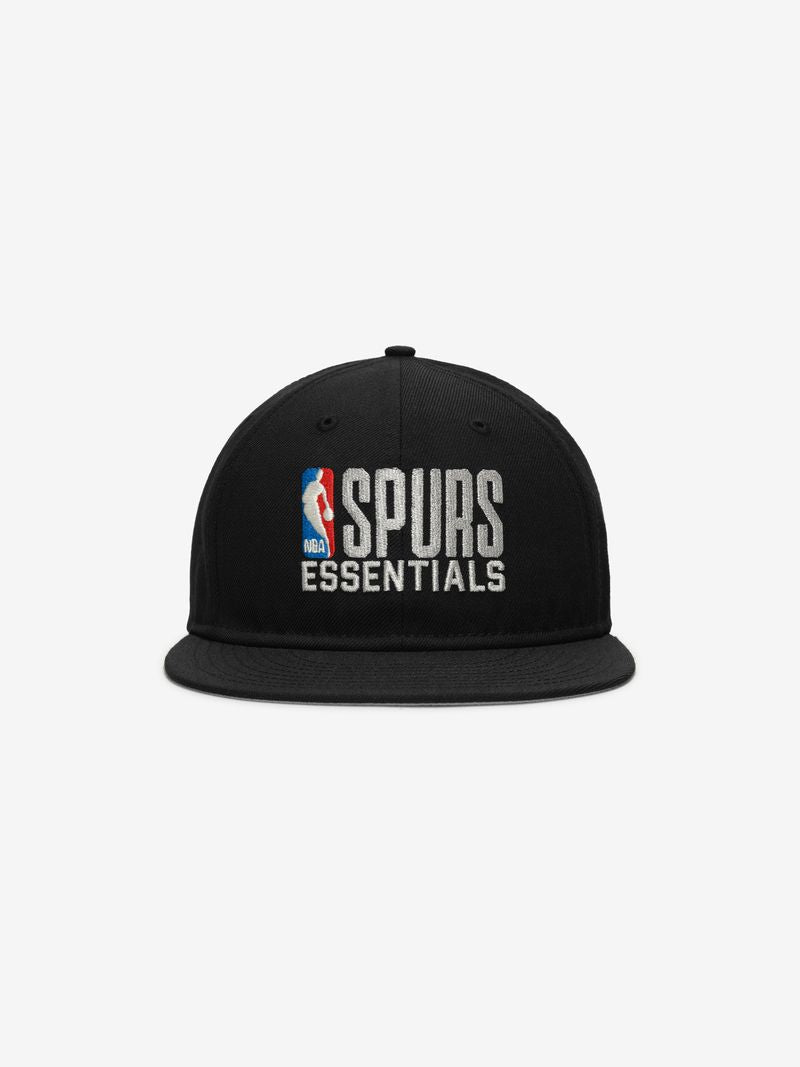 Straight-on view of black Spurs 9Fifty RC Snapback spotlighting white NBA and Spurs Essentials embroidered logos on front panel