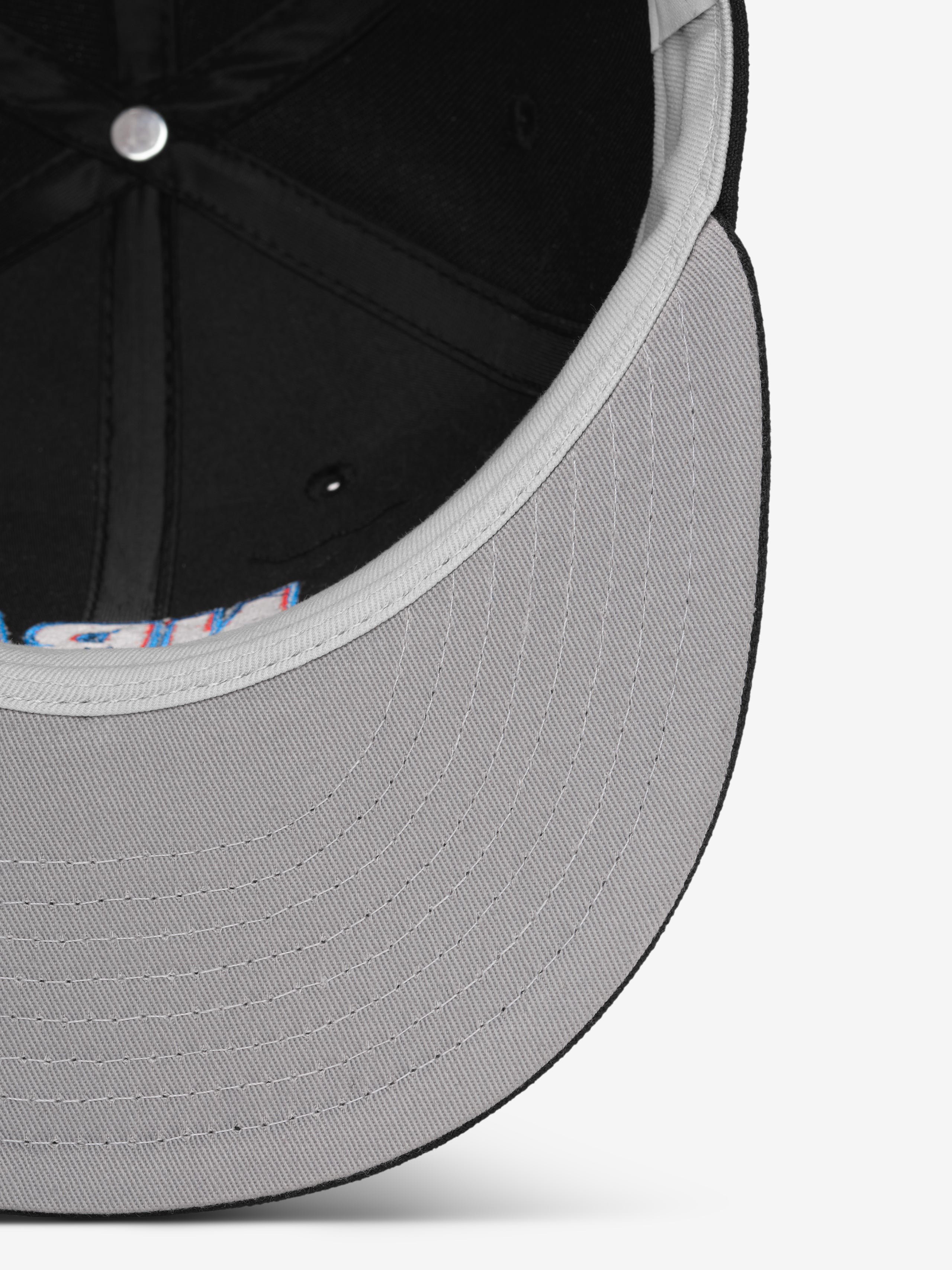 Close-up of a gray cap with a patterned interior on a white background