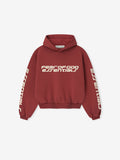 Front view of crimson Kids Classic Hoodie with Fear of God Essentials logo on chest and Essentials text on sleeves