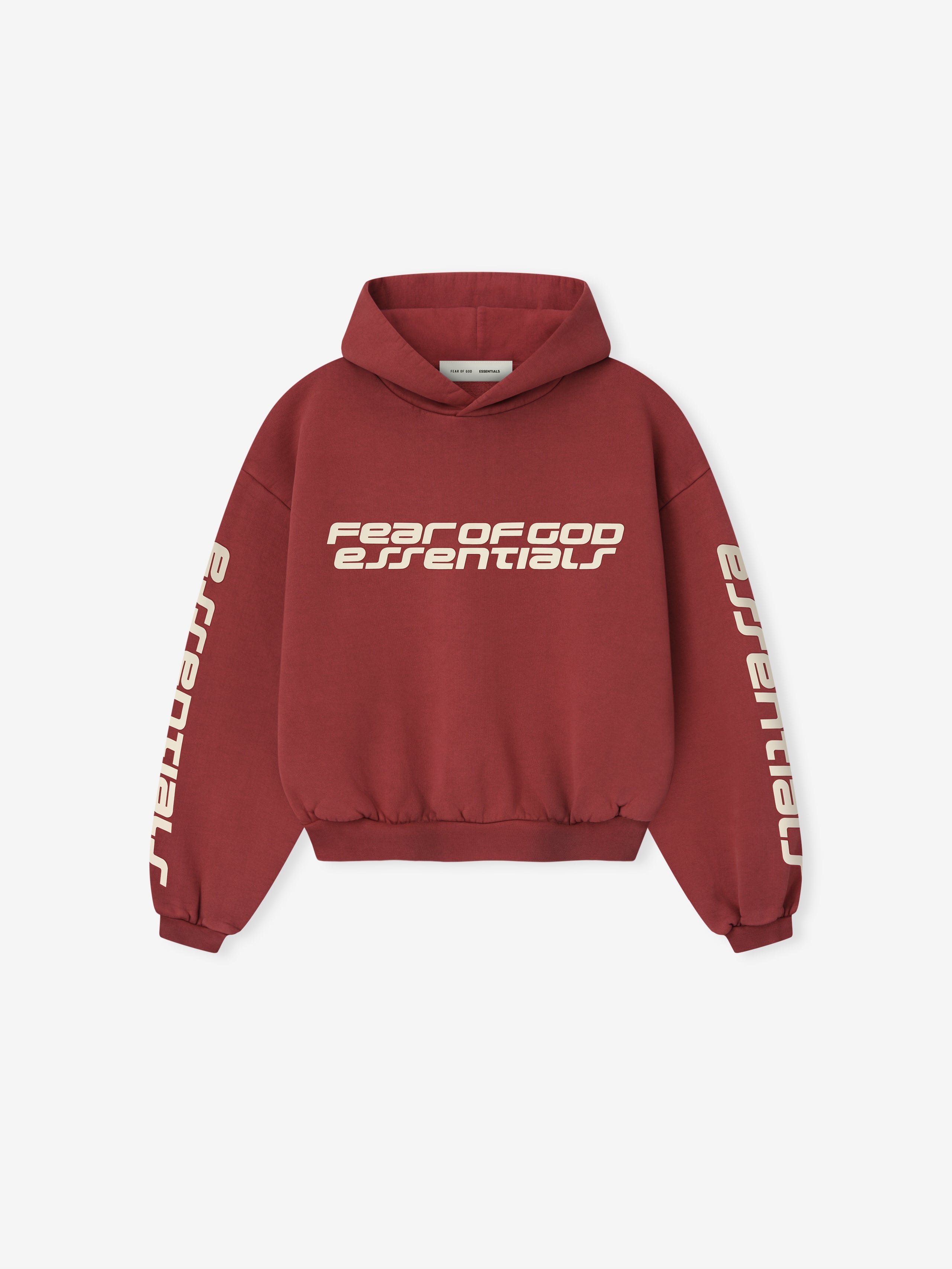 Front view of crimson Kids Classic Hoodie with Fear of God Essentials logo on chest and Essentials text on sleeves