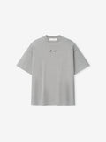 Kids Signature 90s Tee in concrete heather gray with a relaxed fit and small black cursive Essentials logo centered on soft cotton fabric, suitable for casual wear.