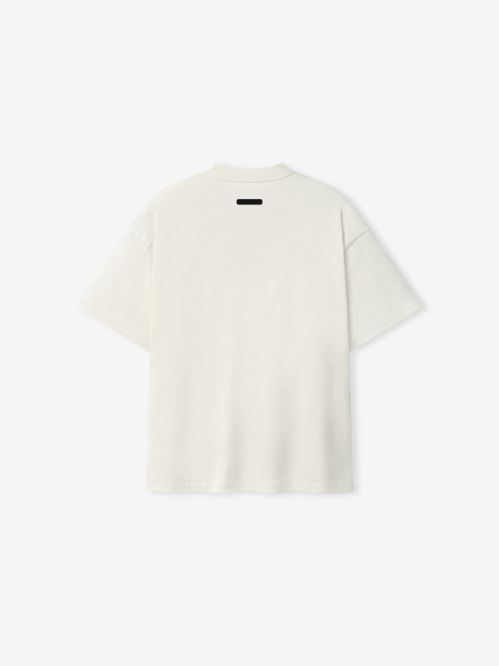 Back view of the Kids Signature 90s Tee in soft ivory fabric with a relaxed fit and a small black label detail at the neckline, designed for casual kids' wear.