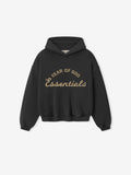 front view of black kids hoodie with puff-printed Fear of God Essentials 90s training logo in tan text