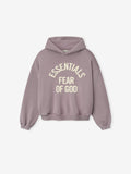 front view of muted mauve kids hoodie with cream Essentials Fear of God text printed in arched layout